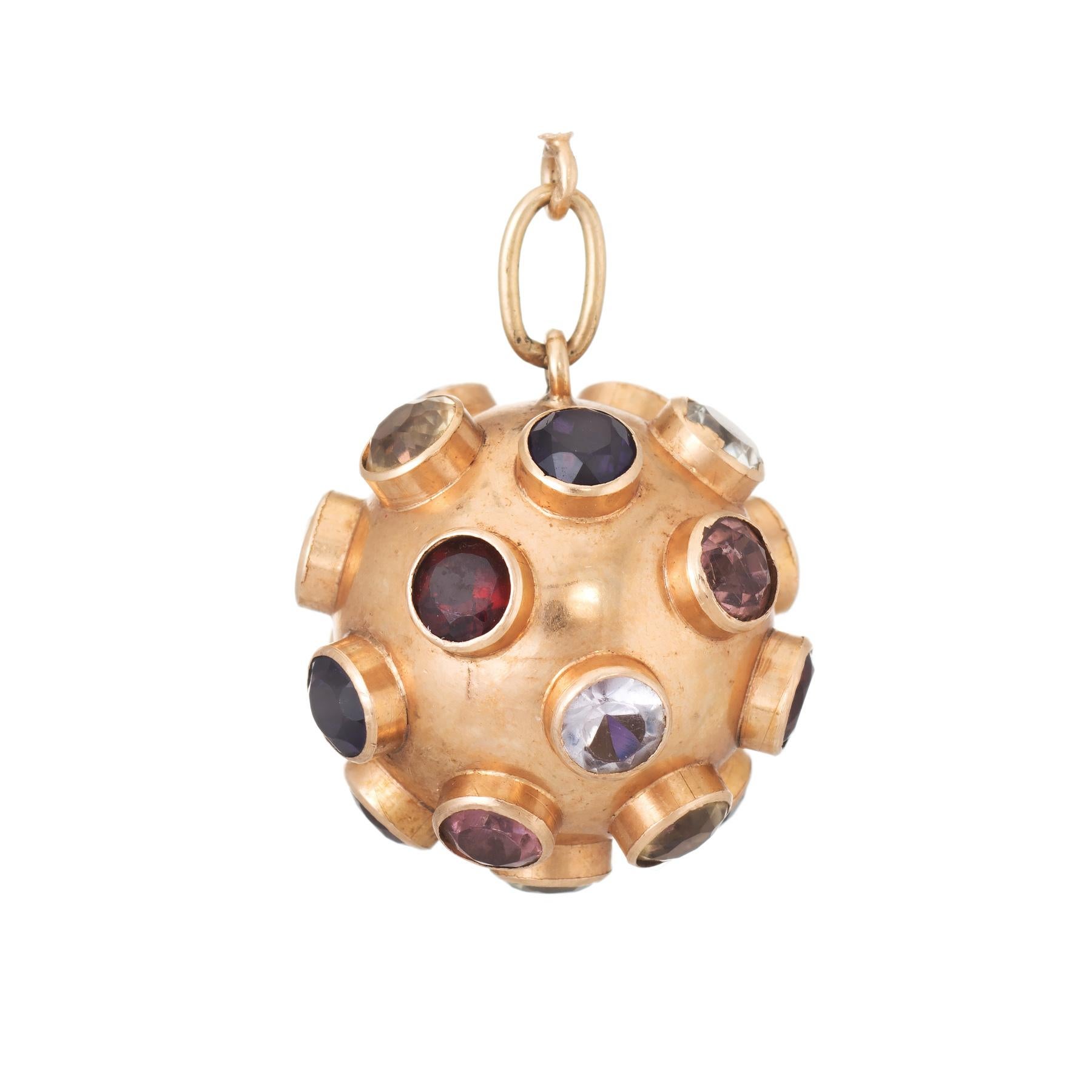 Ornate dome sputnik gemstone pendant (circa 1950s to 1960s), crafted in 18 karat yellow gold. 

Semi precious gemstones (blue topaz, amethyst, aquamarine, pink tourmaline, citrine and garnet & peridot) total an estimated 5 carats. Note: few light