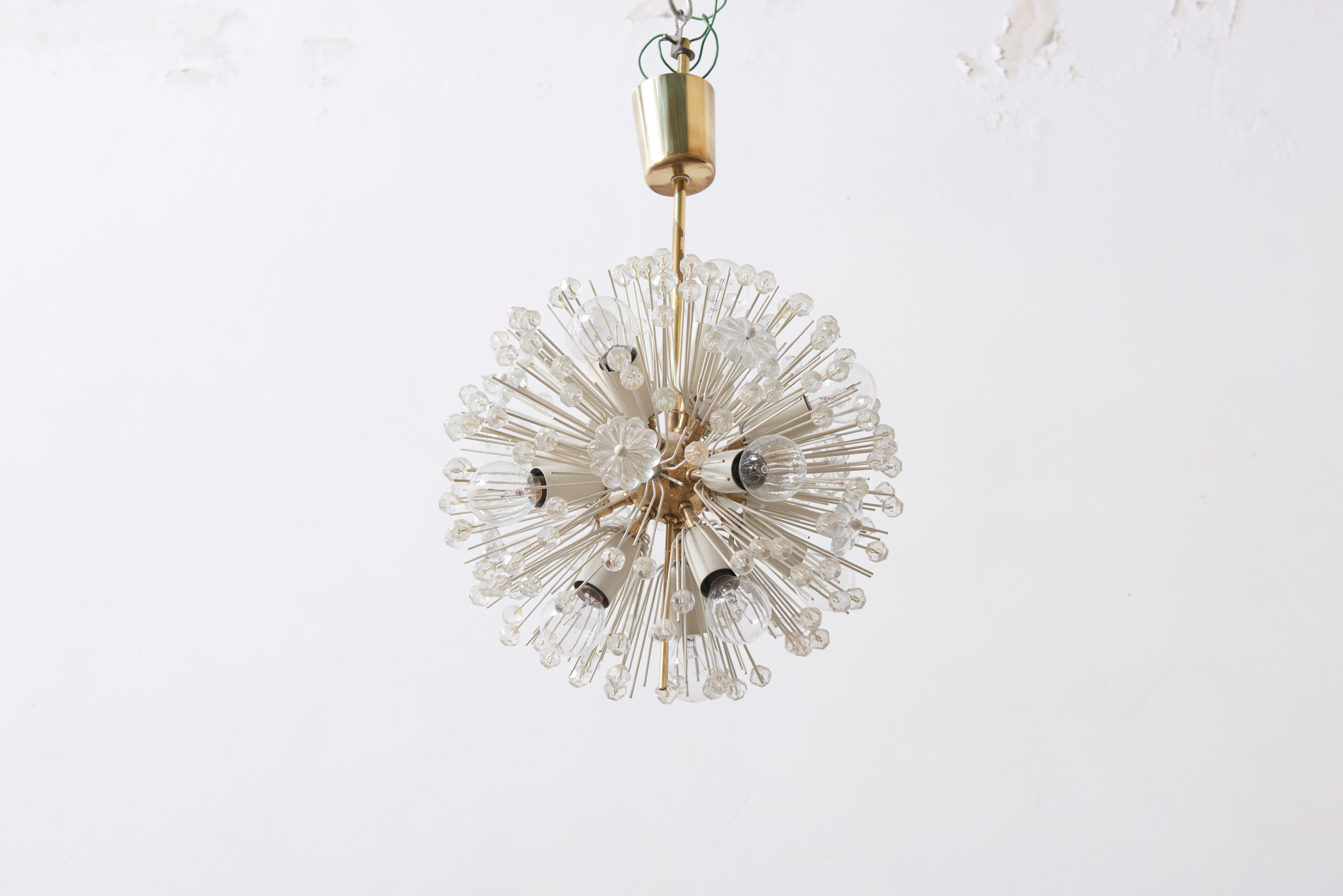 Glass and brass chandelier by Emil Stejnar for Rupert Nikoll, 1950s extra small version of a sputnik chandelier with molded glass flowers and stars.
Due to its compactness and smallness, the accent of light and glass is emphasized in this