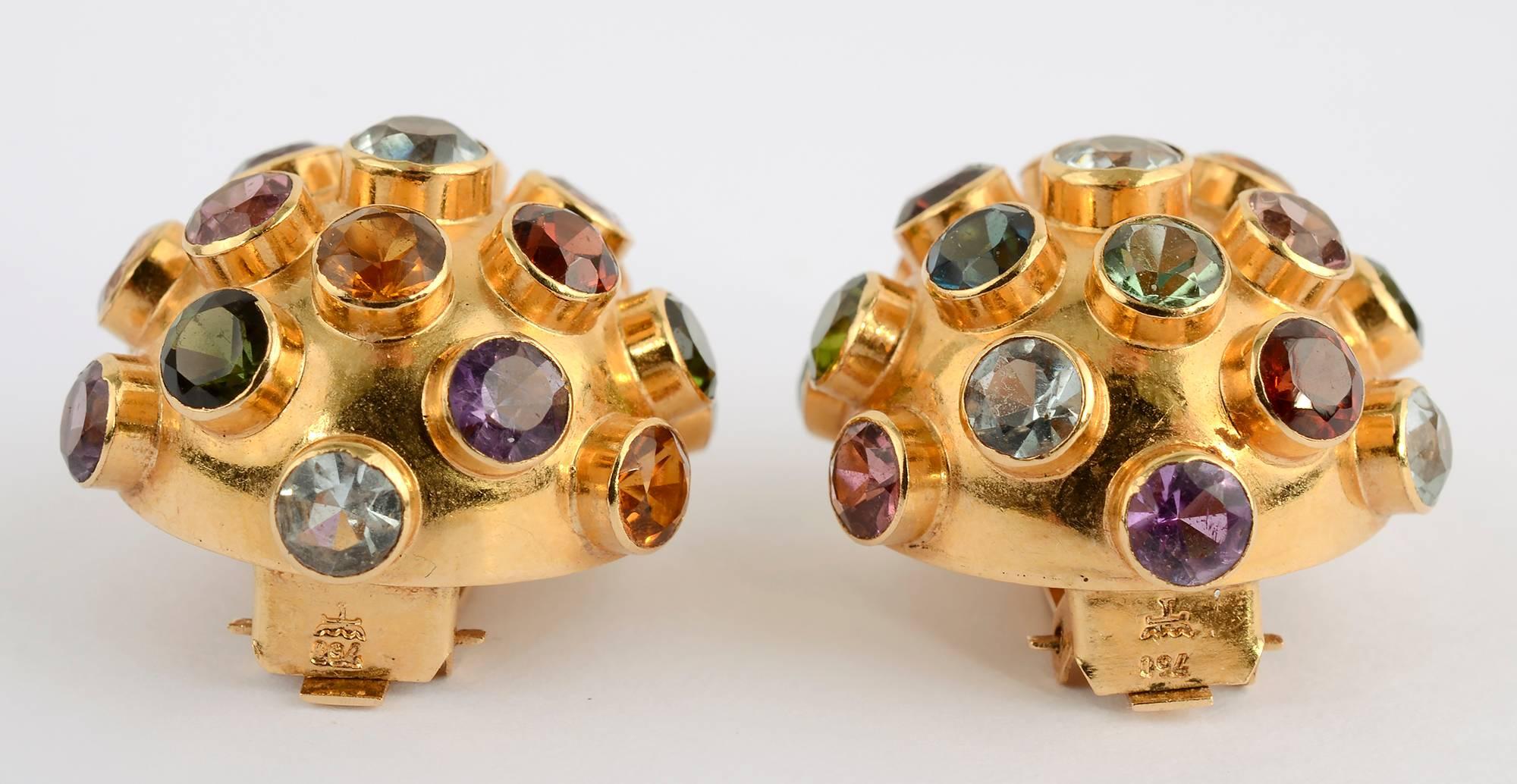 Wonderful 18 karat gold dome earrings covered with semiprecious stones in what is known as the Sputnik design. The stones include: amethyst; tourmaline; peridot; citrine. Clip backs can be converted to posts. 