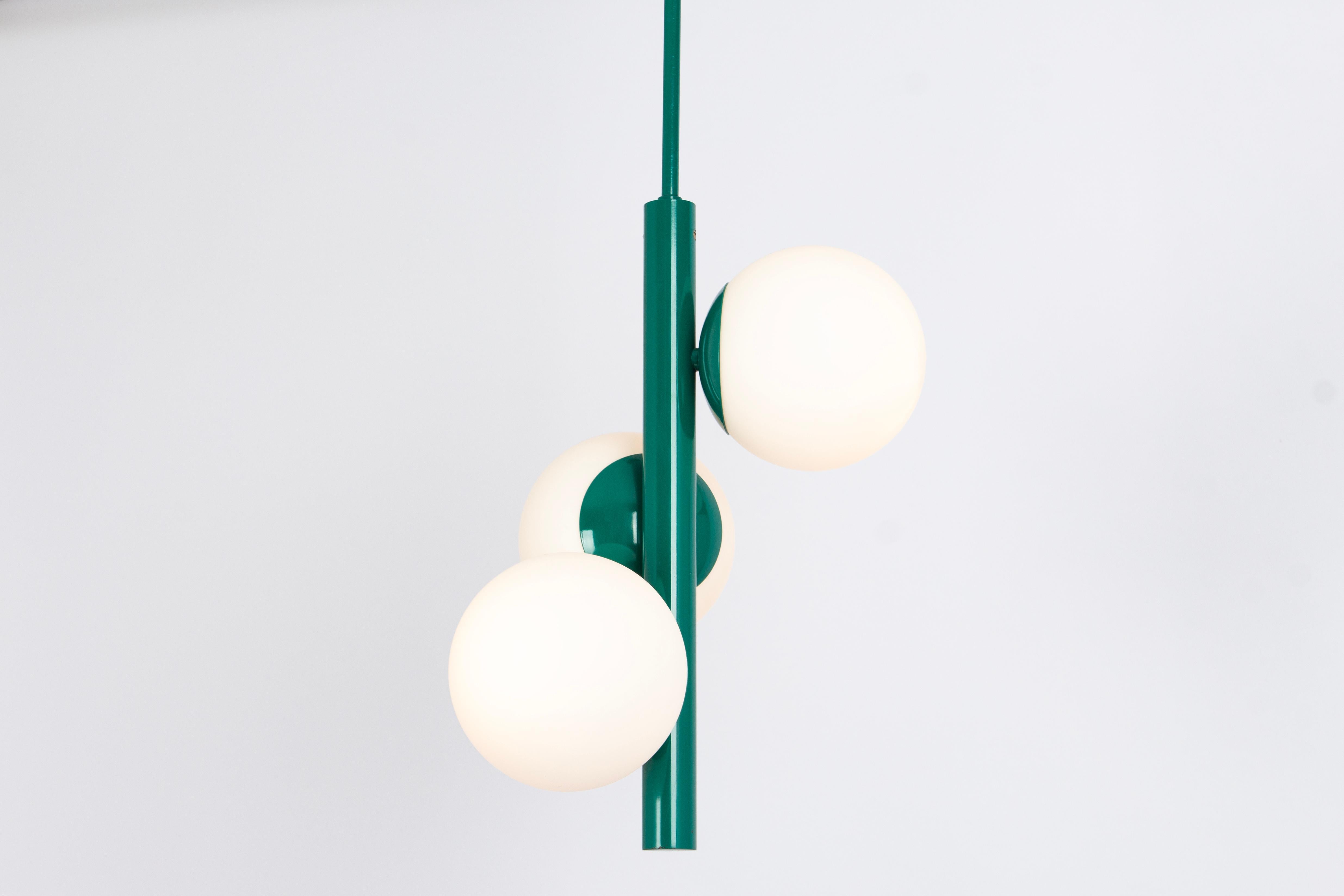 Wonderful Sputnik pendant light made by Kaiser Leuchten, Germany, circa 1970-1979.
Great Atomium-shaped chandelier with 3 opal glass pieces.
This exquisite lighting fixture boasts a captivating green color that adds a touch of sophistication and