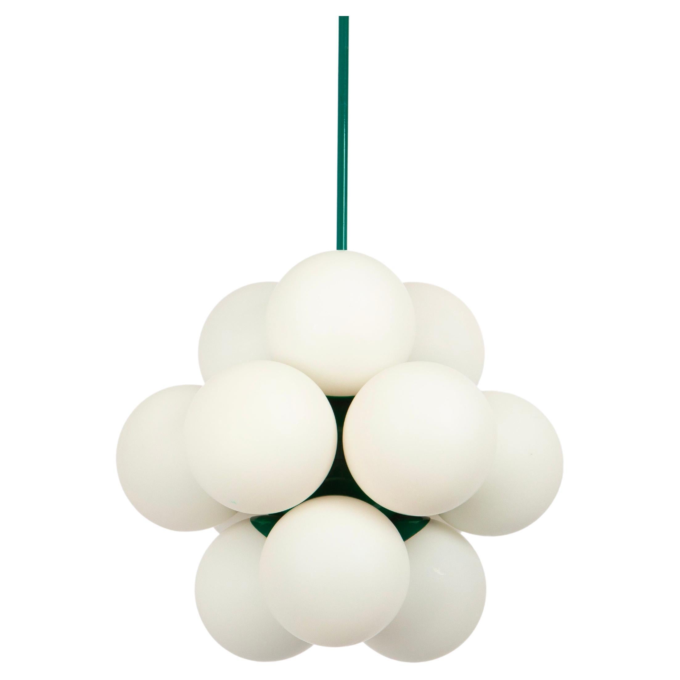 1 of 2 Wonderful Sputnik pendant light made by Kaiser Leuchten, Germany, circa 1970-1979.
Great Atomium-shaped chandelier with 12 opal glass pieces.
This exquisite lighting fixture boasts a captivating green hue that adds a touch of sophistication