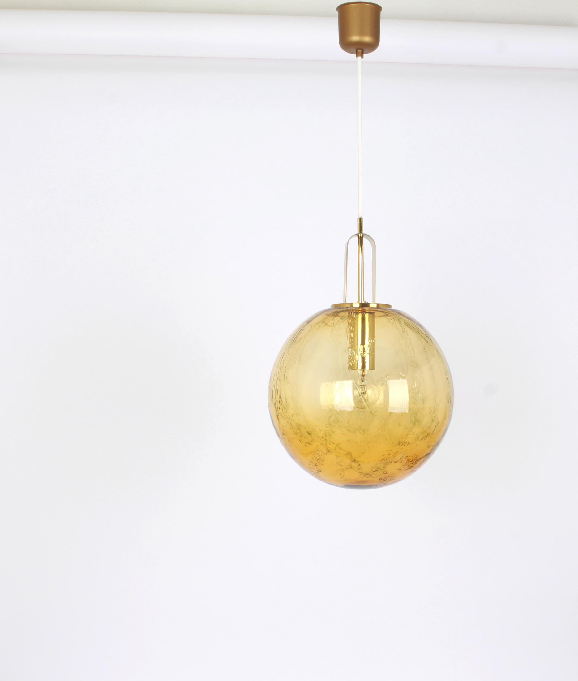 Ceiling light with large volcanic murano glass dome with a brass frame made by Doira, Germany.
Wonderful light effect.
High quality and in very good condition. Cleaned, well-wired and ready to use. 
The fixture requires 1 x E27 Standard bulbs with