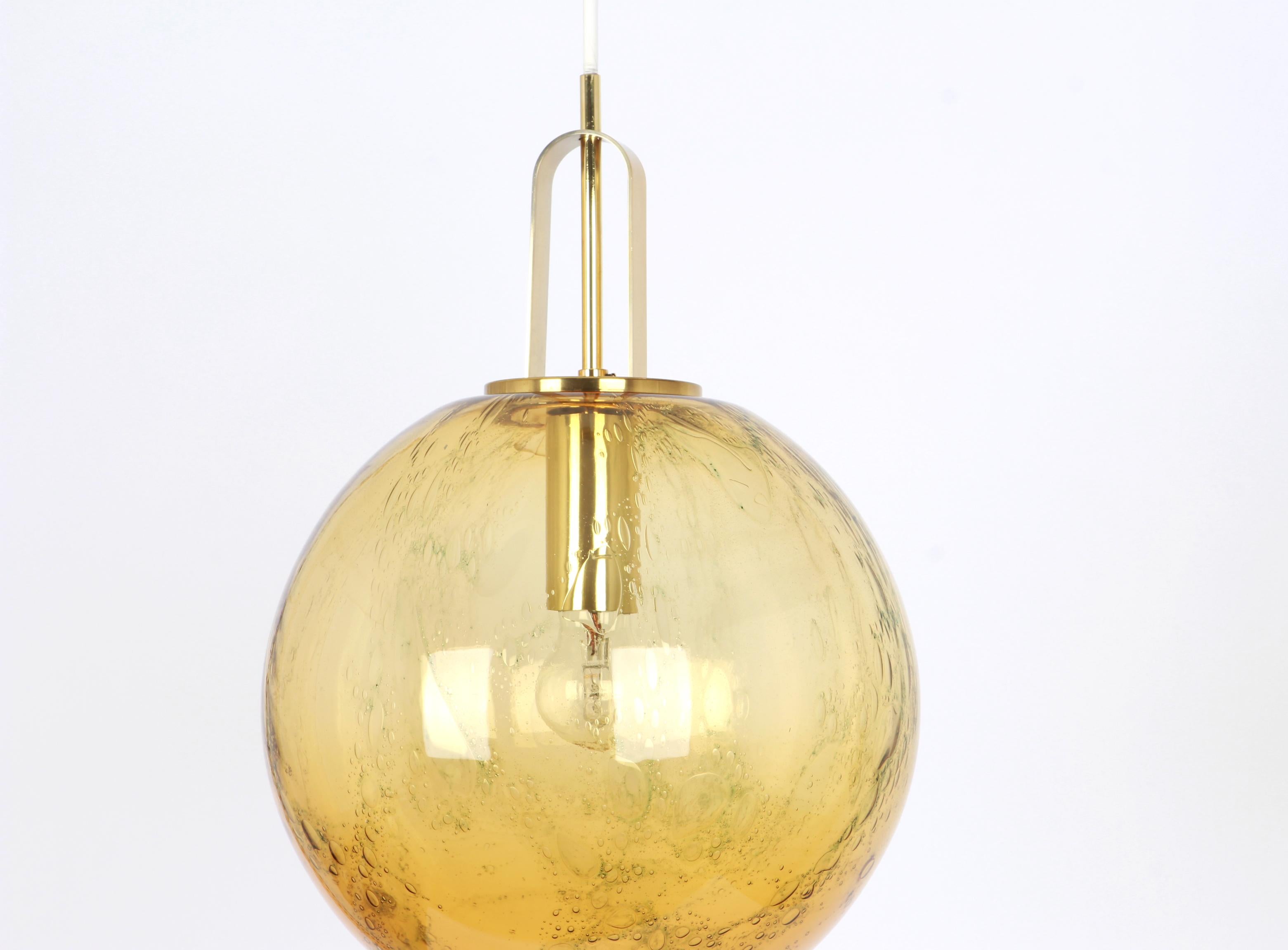 Ceiling light with large volcanic murano glass dome with a brass frame made by Doira, Germany.
Wonderful light effect.
High quality and in very good condition. Cleaned, well-wired and ready to use. 
The fixture requires 1 x E27 Standard bulbs