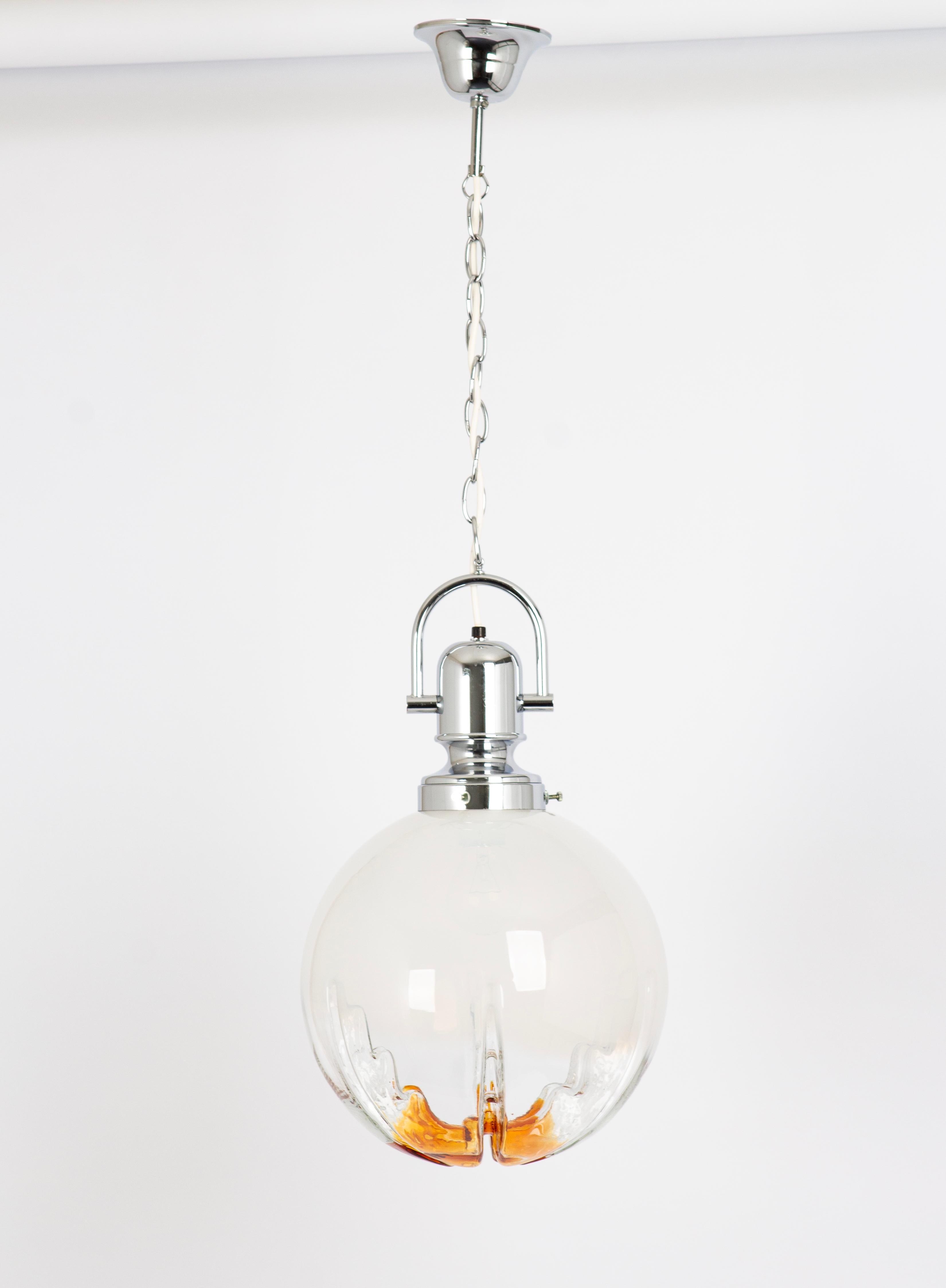 Ceiling light with large volcanic Murano glass dome with a metal frame, Italy.
Wonderful light effect.
Good condition. Cleaned, well-wired, and ready to use. 
The fixture requires 1 x E27 Standard bulbs with 100W max each and is compatible with the