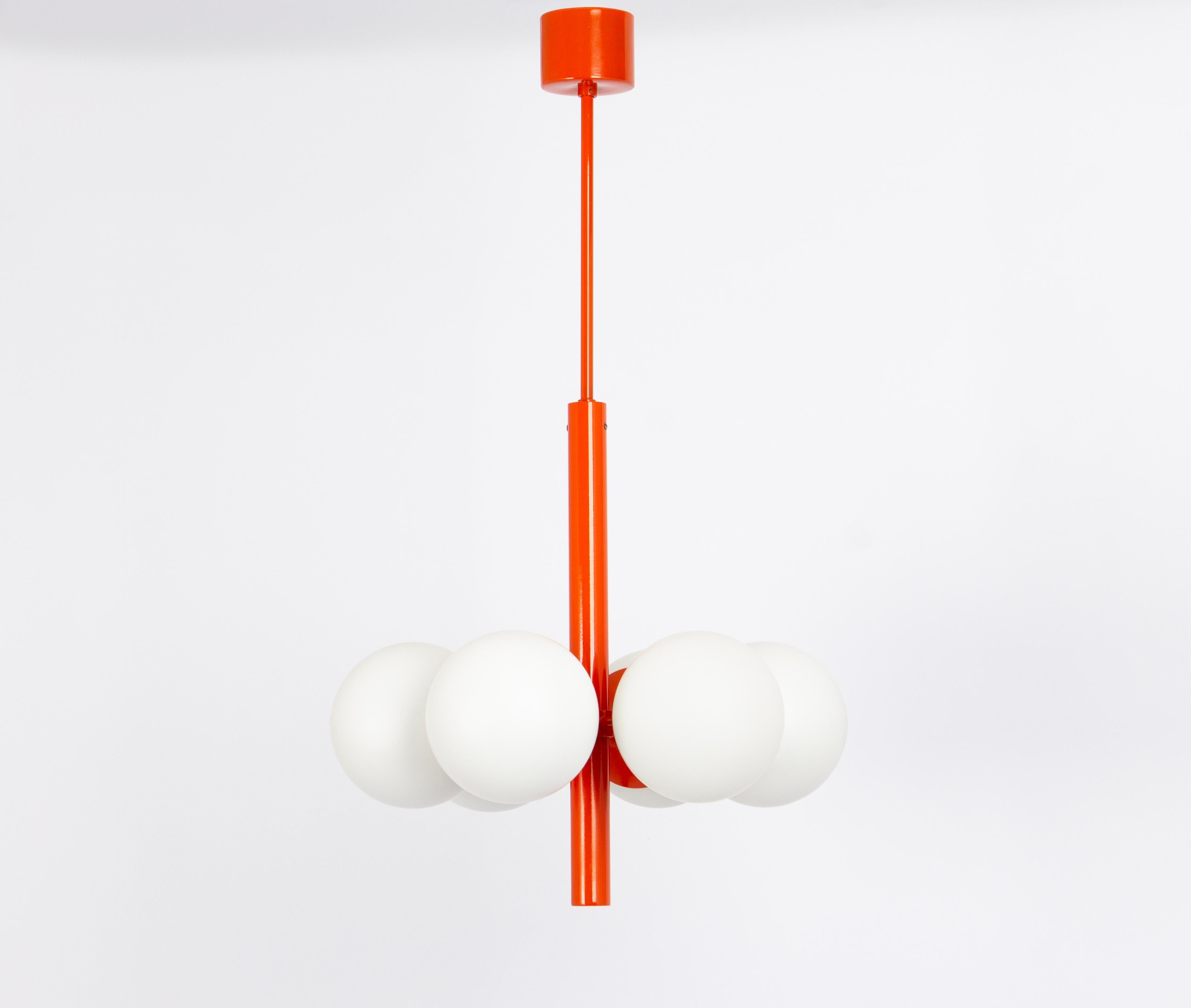 Wonderful Sputnik pendant light made by Kaiser Leuchten, Germany, circa 1970-1979.
Great Atomium-shaped chandelier with 6 opal glass pieces.
This exquisite lighting fixture boasts a captivating orage color that adds a touch of sophistication and