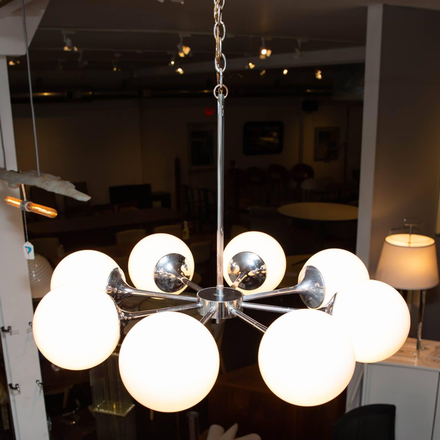 Eight globe chandelier from the 1960s ready to light up your space for the next 50 years. Height can be lengthened with new chain.