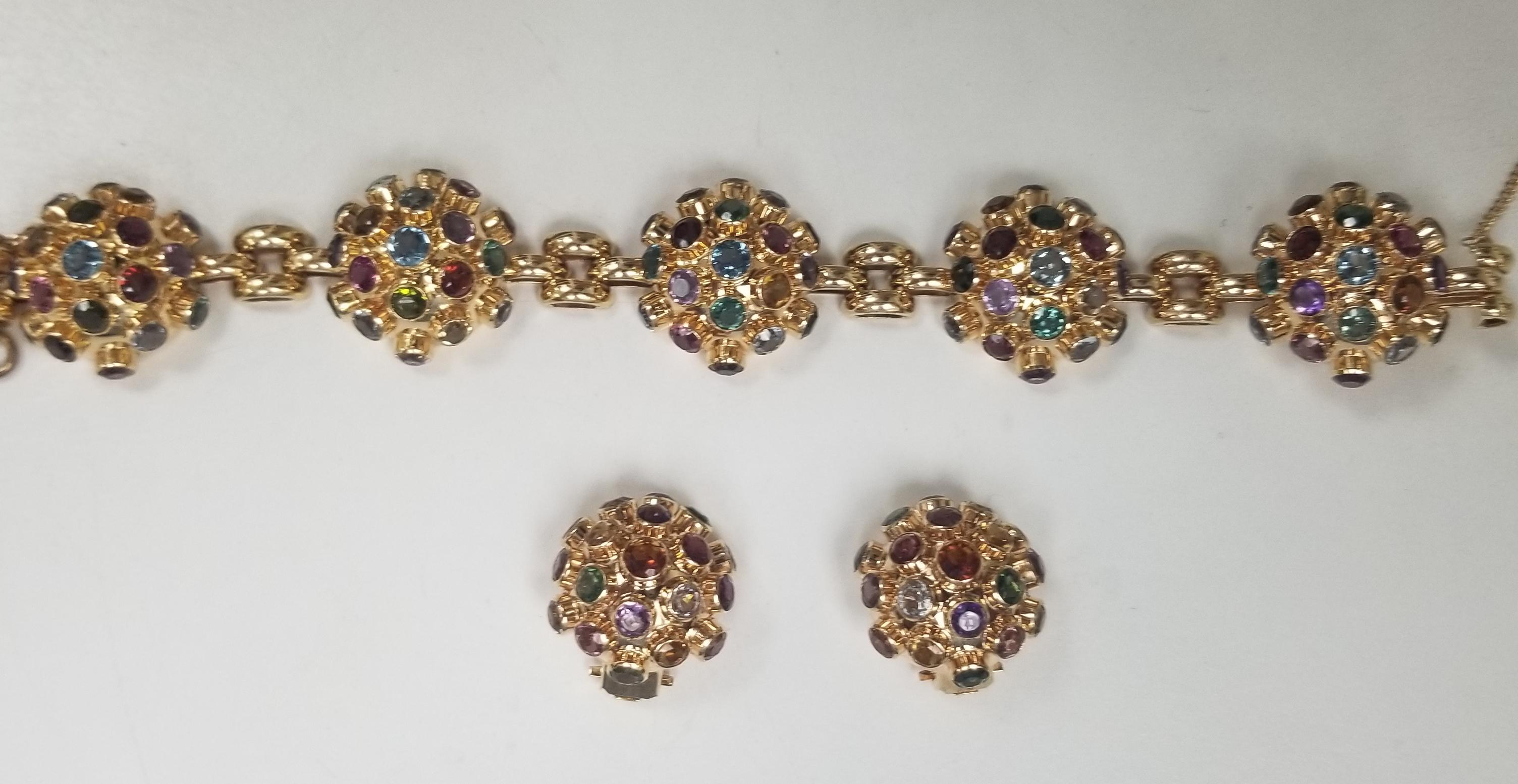 Bracelet and earring set.
A vintage Sputnik style bracelet in 18 karat rose gold. Featuring a plethora of gemstones including 95 stones Pink and Green tourmaline, Amethyst, Citrine, Garnet, Aquamarine, and more this is a fantastic example of an