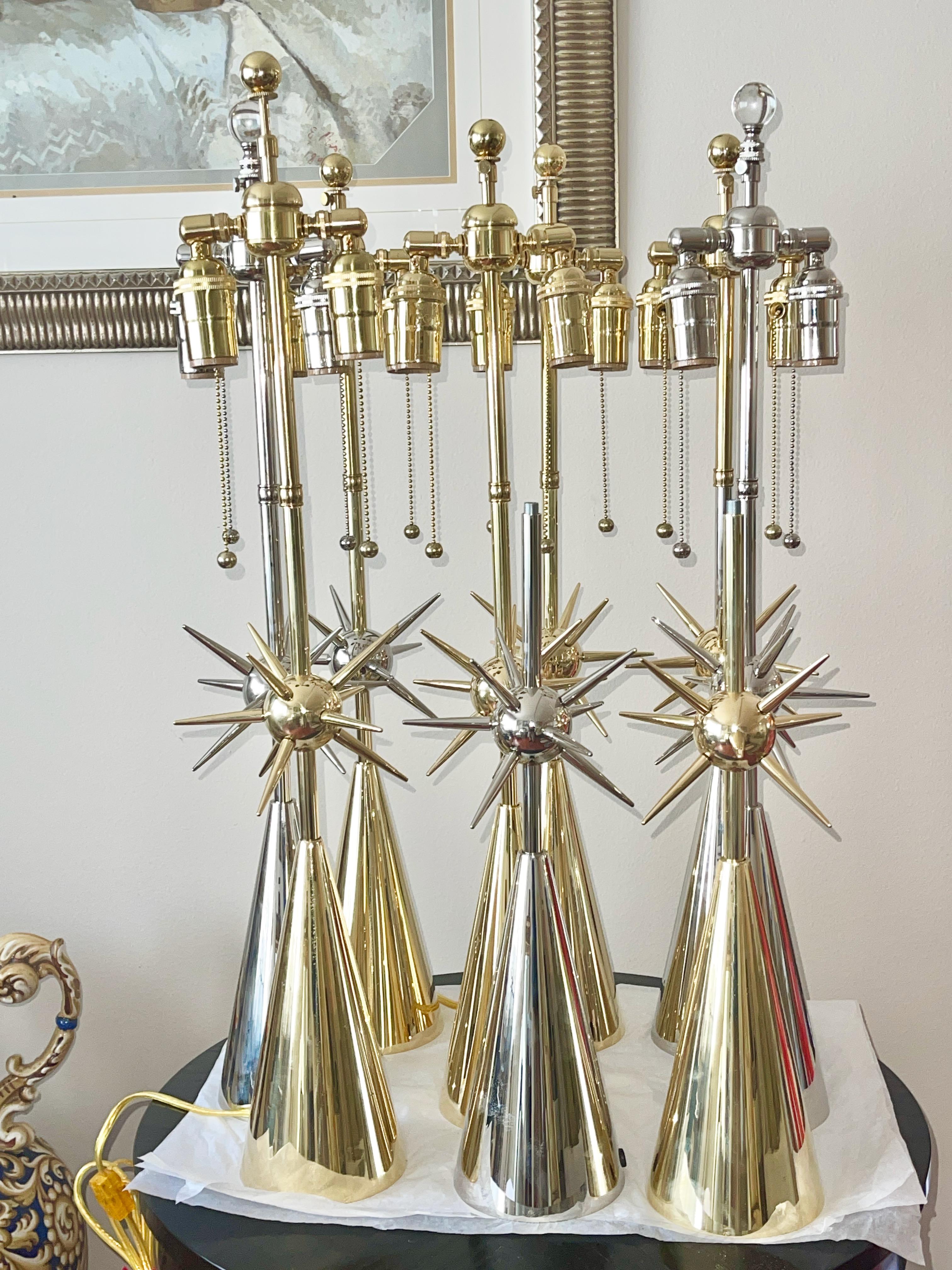 CURRENTLY WE HAVE IN STOCK FIVE BRASS AND FOUR NICKEL LAMPS AVAILABLE FOR IMMEDIATE DELIVERY

One of my favorite lamps. I love the atomic mace-like sputnik starburst ball of spikes seeming to hover above the crisp round brass conical base.
It is
