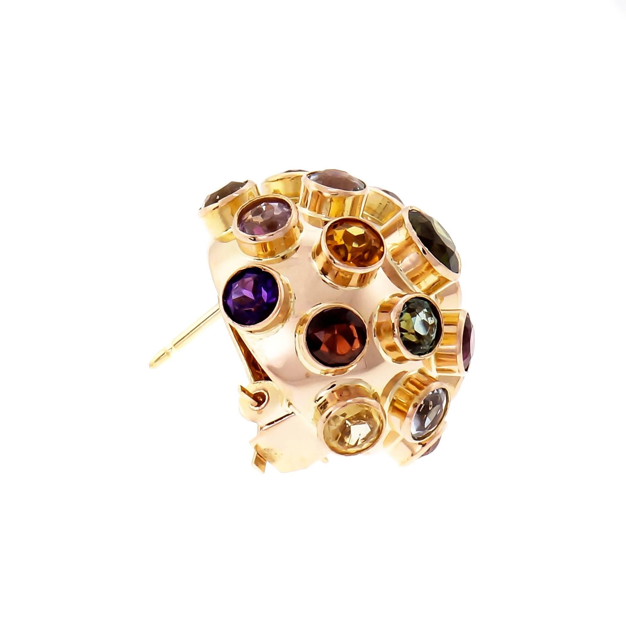 Vintage Sputnik style domed earrings in 14k yellow gold with clip and post set with 38 round natural untreated gemstones.

38 round multi-colored natural gemstones; Tourmaline, Aqua, Amethyst, Citrine and Garnet.
14k yellow gold 
8.3 grams 
Tested: