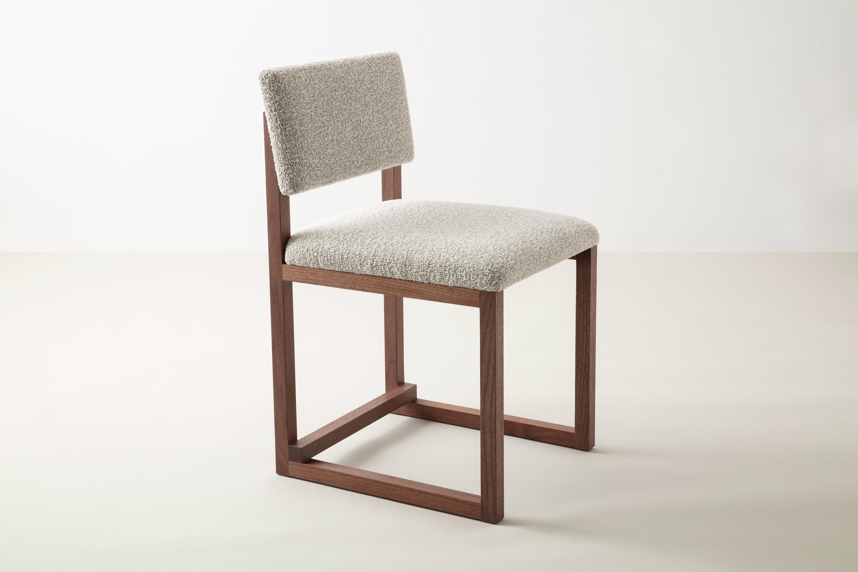 Shown in solid walnut, bouclé wool, and brushed brass hardware
 
Available with:
Wood in ash, cherry, maple, walnut, or white oak 
special edition ebonized ash and white washed ash upon custom request 

Upholstery in customer’s own material or