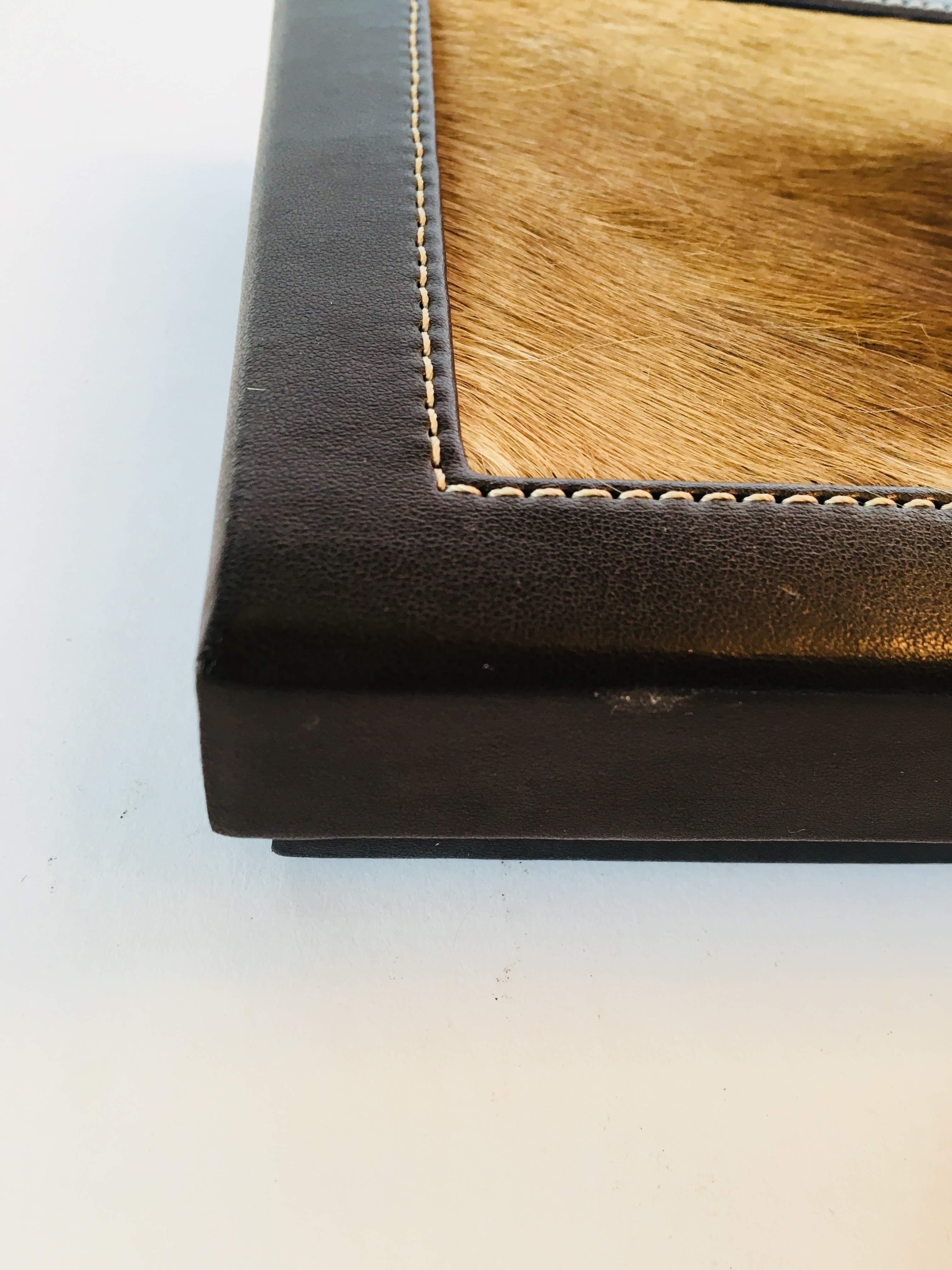 Square leather African box with lid and springbok hide.