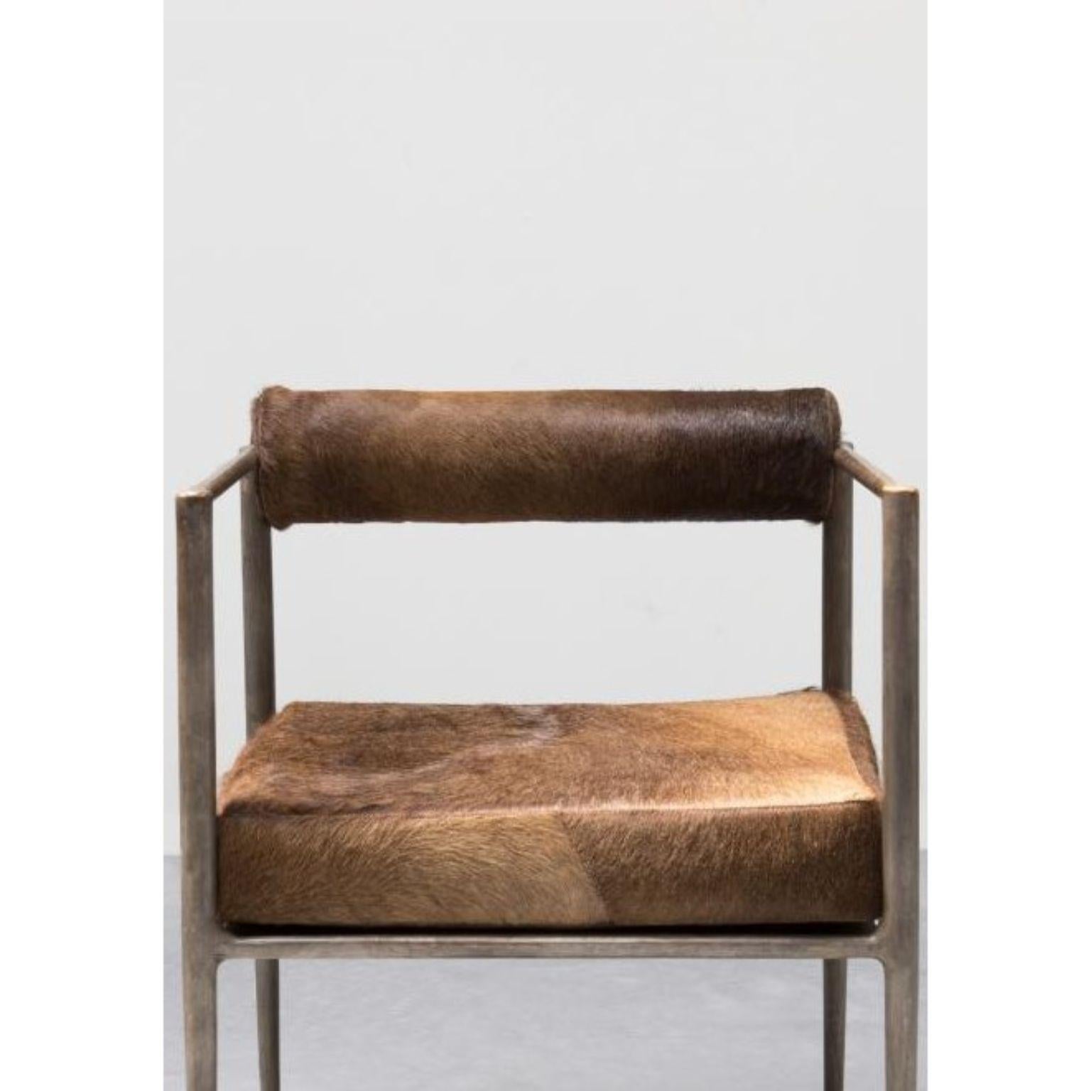 Square Alchemy chair by Rick Owens
2015
Dimensions: L 60 x W 60 x H 76 cm
Materials: Bronze, camel skin
Weight: 40 kg

Rick Owens is a California-born fashion and furniture has developed a unique style that he describes as “luxe minimalism.”
Though