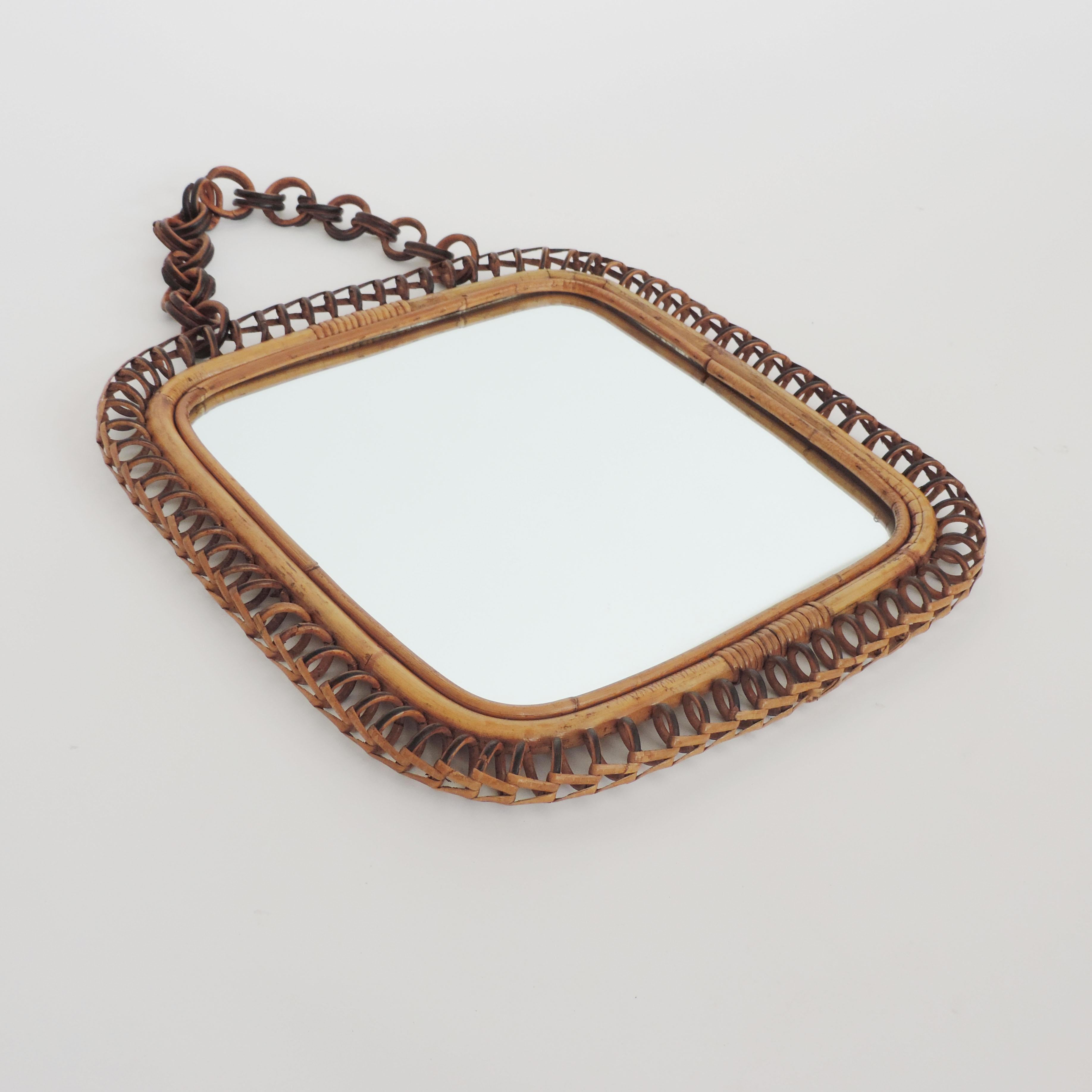 Splendid squareand undulating wicker and Bamboo wall mirror, Italy, 1950s.
With its original bamboo chain.