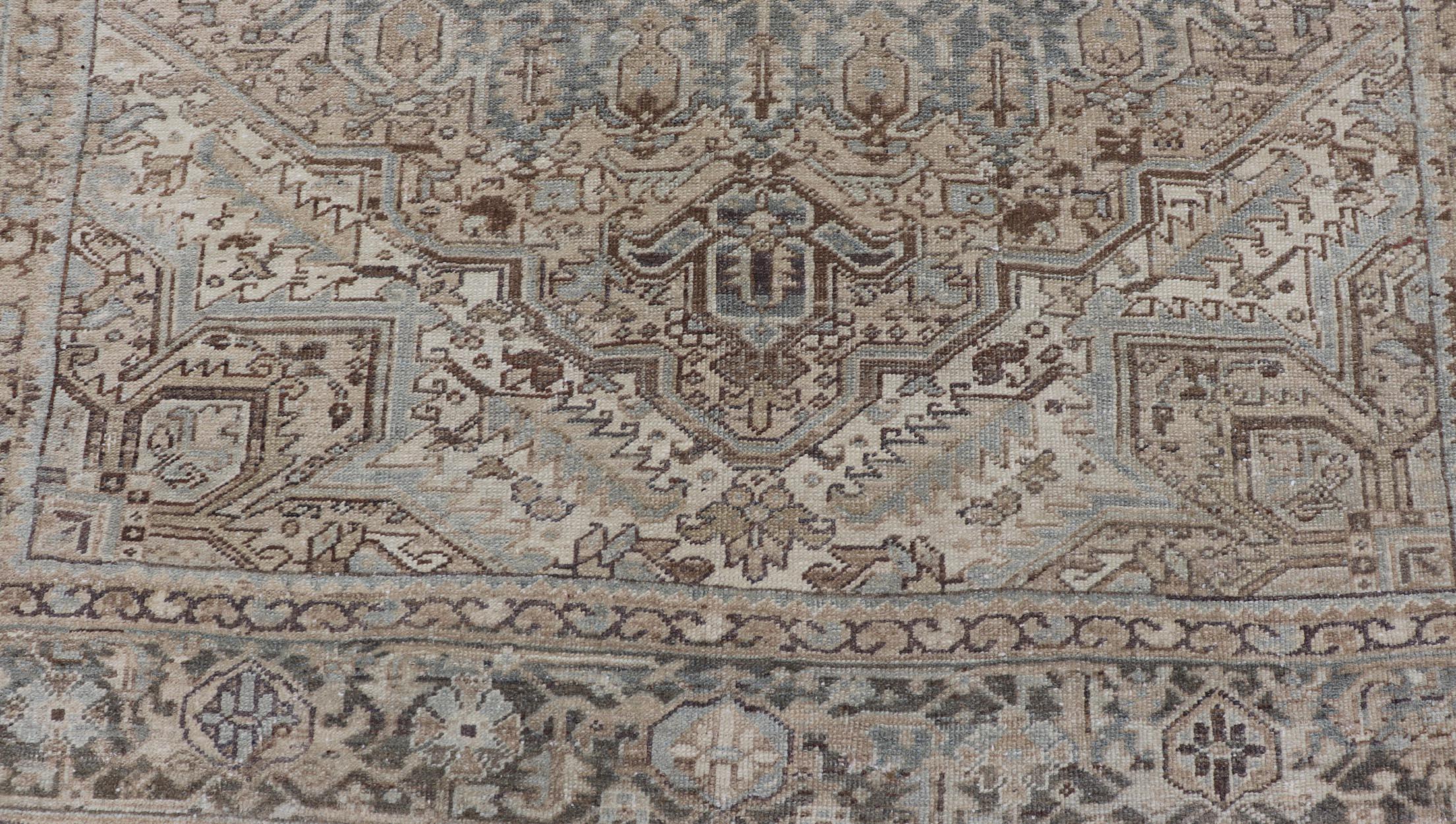 Square Antique Heriz Rug with Geometric Design in Light brown, Blue, Steel blue, Tan, Cream, and medium Brown. Keivan Woven Arts / rug EN-15000, country of origin / type: Iran / Heriz, circa 1930

Measures: 7'6 x 8'5 

This square Persian Heriz