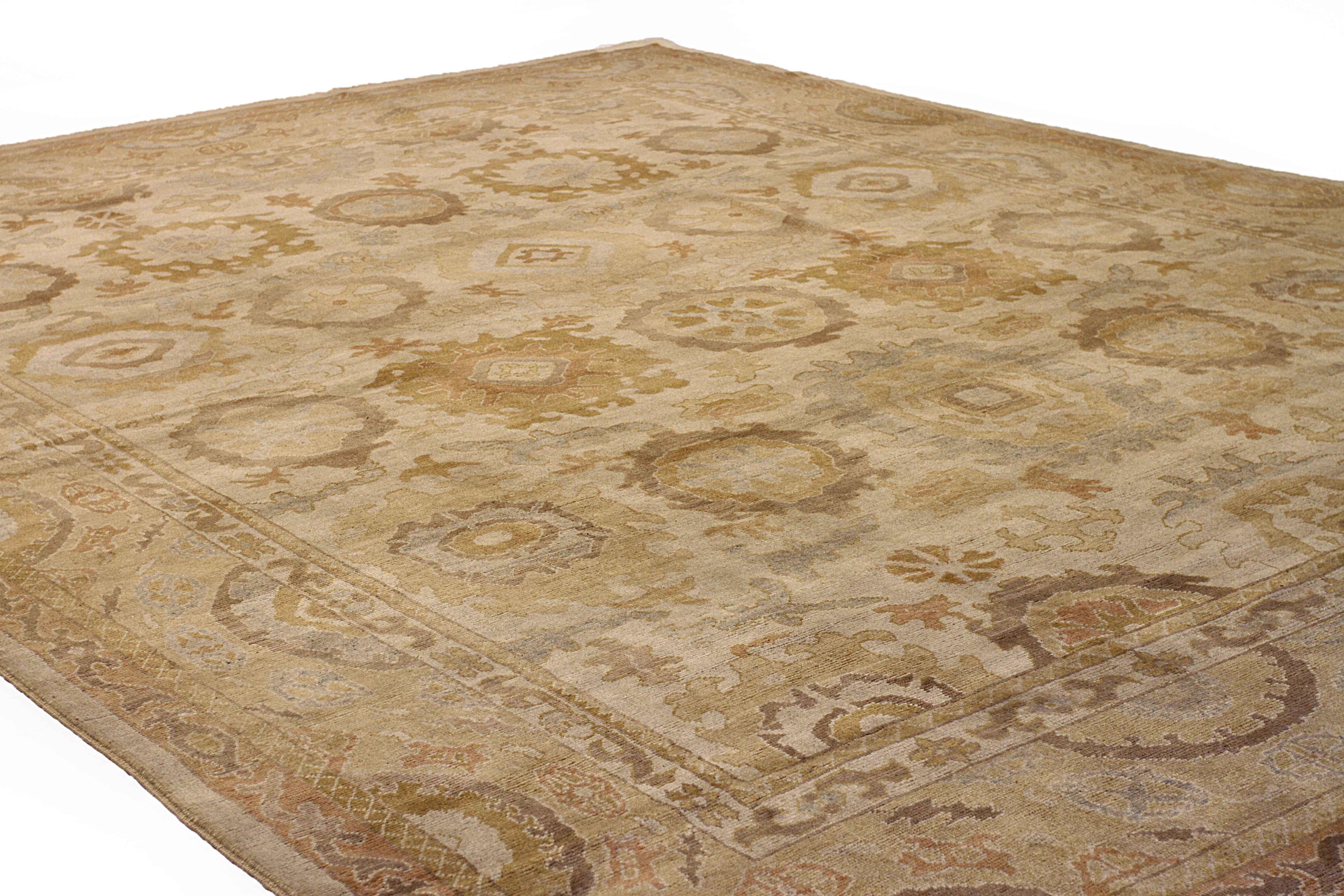 Hand-Woven Antique Turkish Oushak Area Rug with Floral Details on Brown Field For Sale