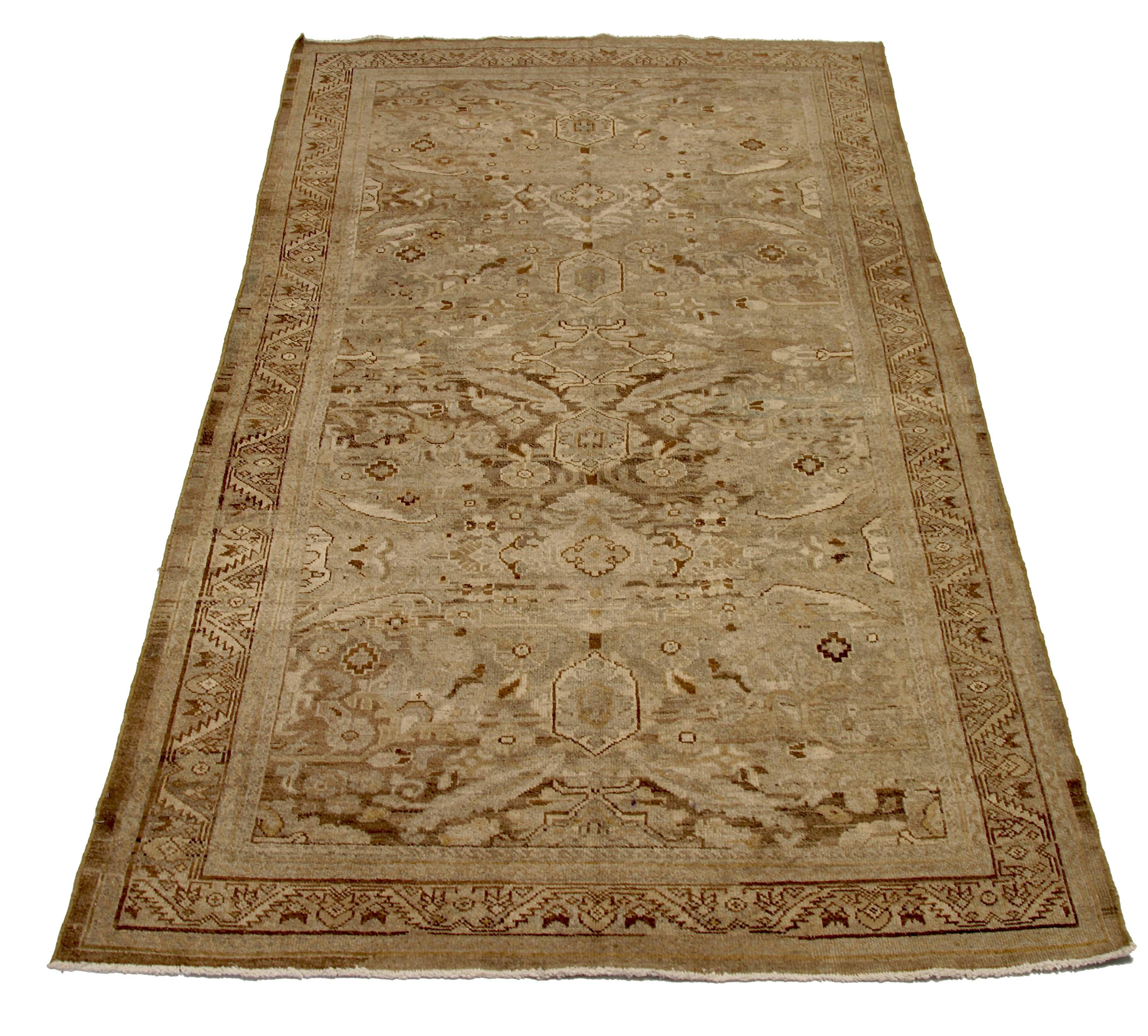 Antique handmade Persian area rug from high quality sheep’s wool and colored with eco-friendly vegetable dyes that are proven safe for humans and pets alike. It’s a classic Sultanabad design showcasing a regal brown field with prominent Herati