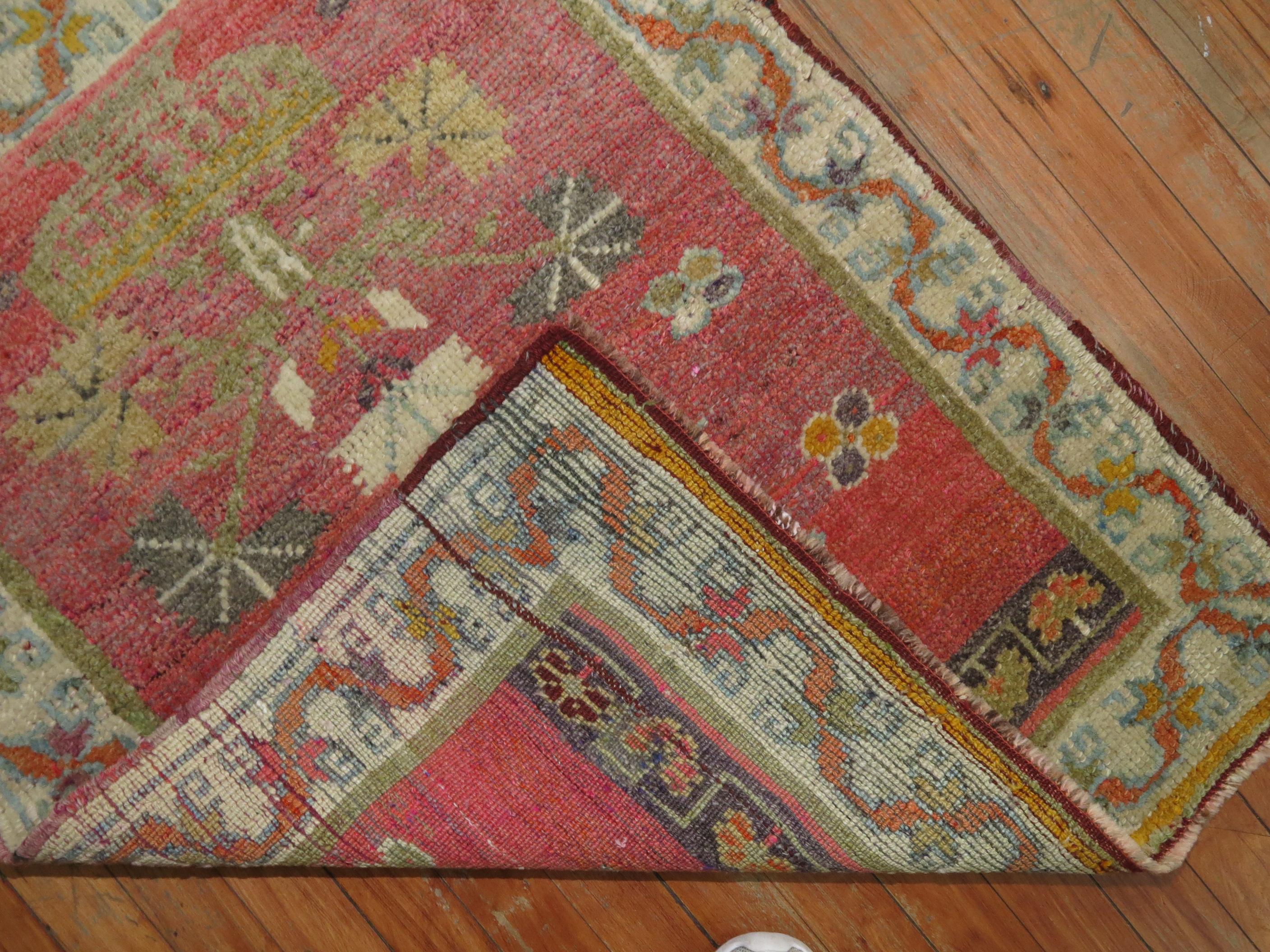Soft pink coral color midcentury Turkish Anatolian rug.

Measures: 2'7” x 3'3”.