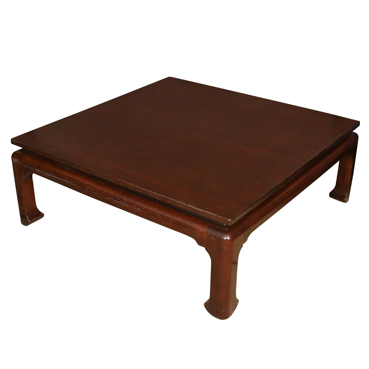A vintage Asian style square coffee table in polished dark wood with Ming shaped legs and feet.