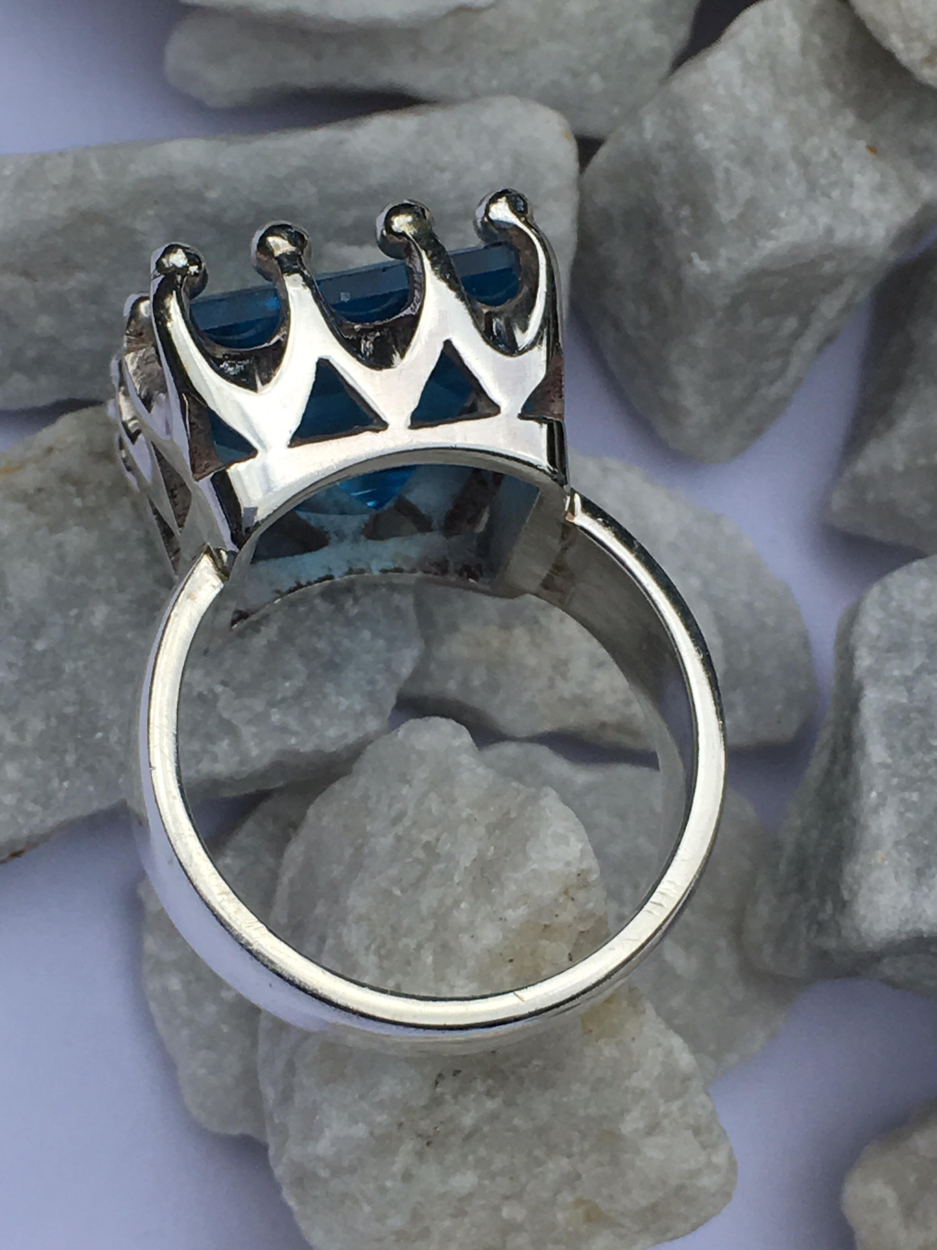 Square 13 MM Blue Topaz set in sterling silver is Hand Crafted Ring.
One of a Kind crown Design Ring is size 7.5 if needed you can resize.
If you need Matching pendant we have listed Pendant as well.
Total weight of the ring is 10.90 Gram