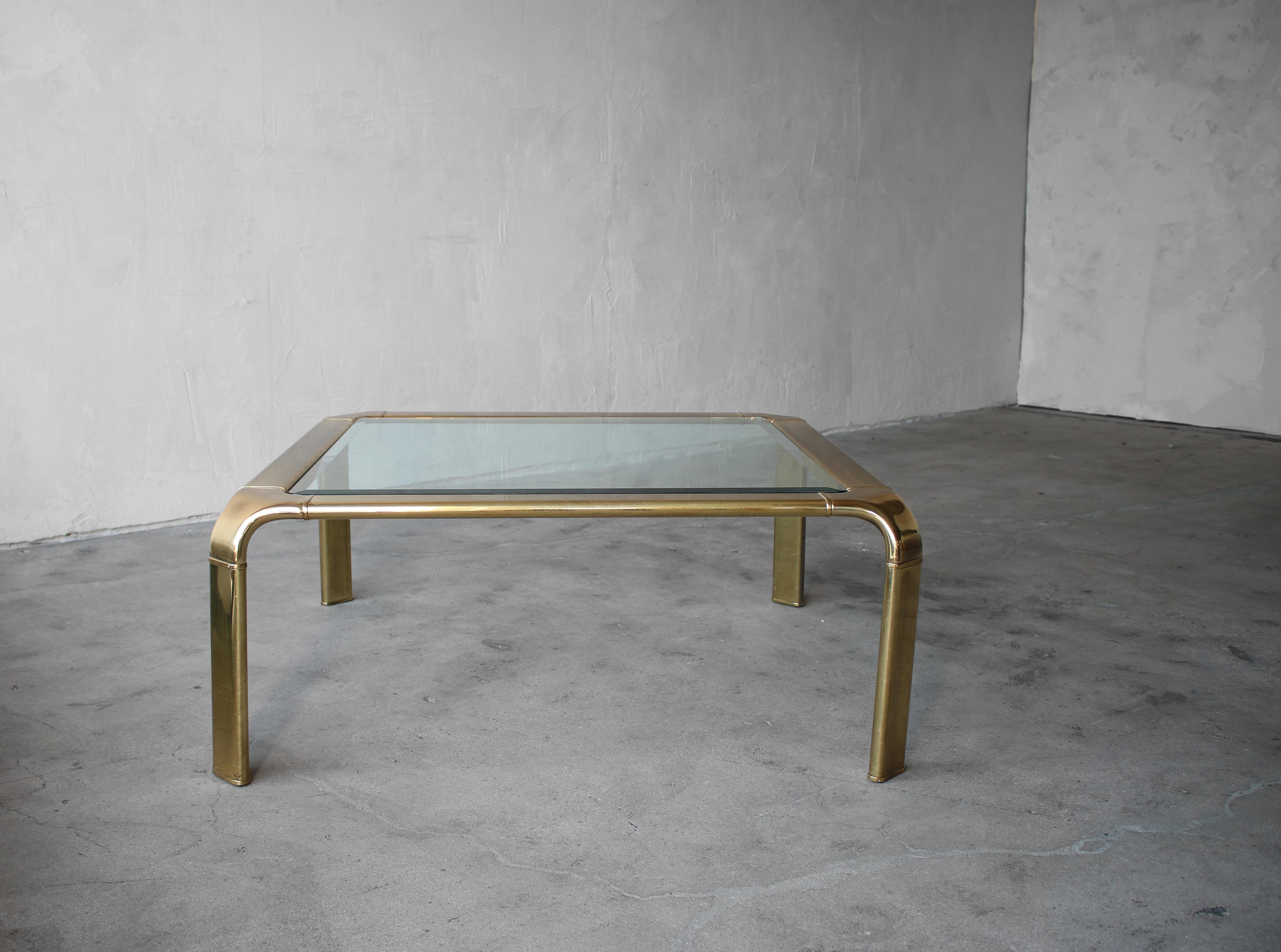 A simple, beautiful brass and glass coffee table by John Widdicomb.

Table is in excellent condition showing little to no wear.
