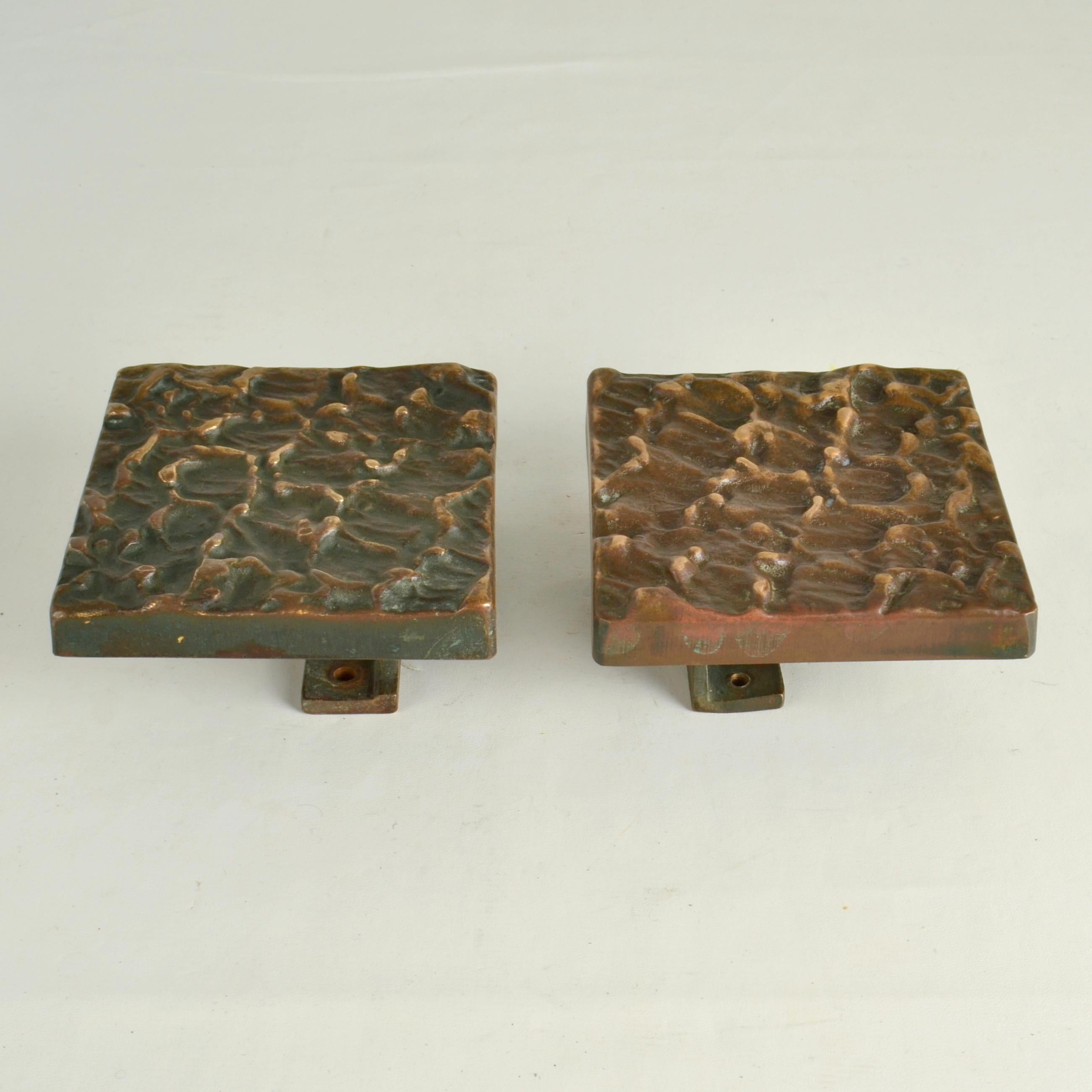 Brutalist pair of square bronze push & pull door handles with subtle relief are made in the 1960-70's. These pieces are made of cast bronze and are in perfect condition. The bronze is oxidised, creating an original patina to the textured surface due
