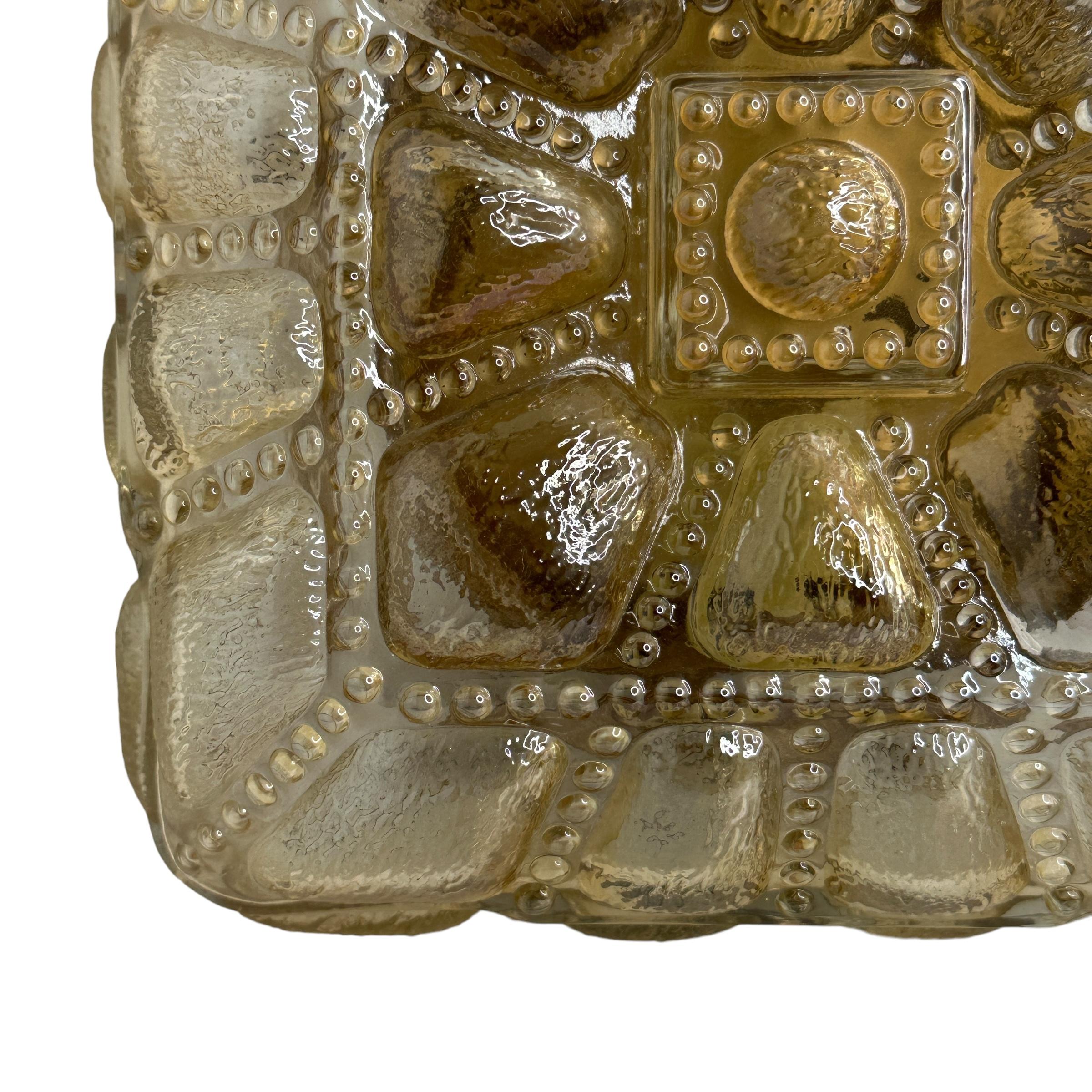 Beautiful bubbled glass flush mount from the 1960s. Fantastic glass quality. Gorgeous textured glass flush mount with metal fixture. The glass has some light amber tone. The fixture requires one European E27 Edison bulb up to 60 watts. A nice