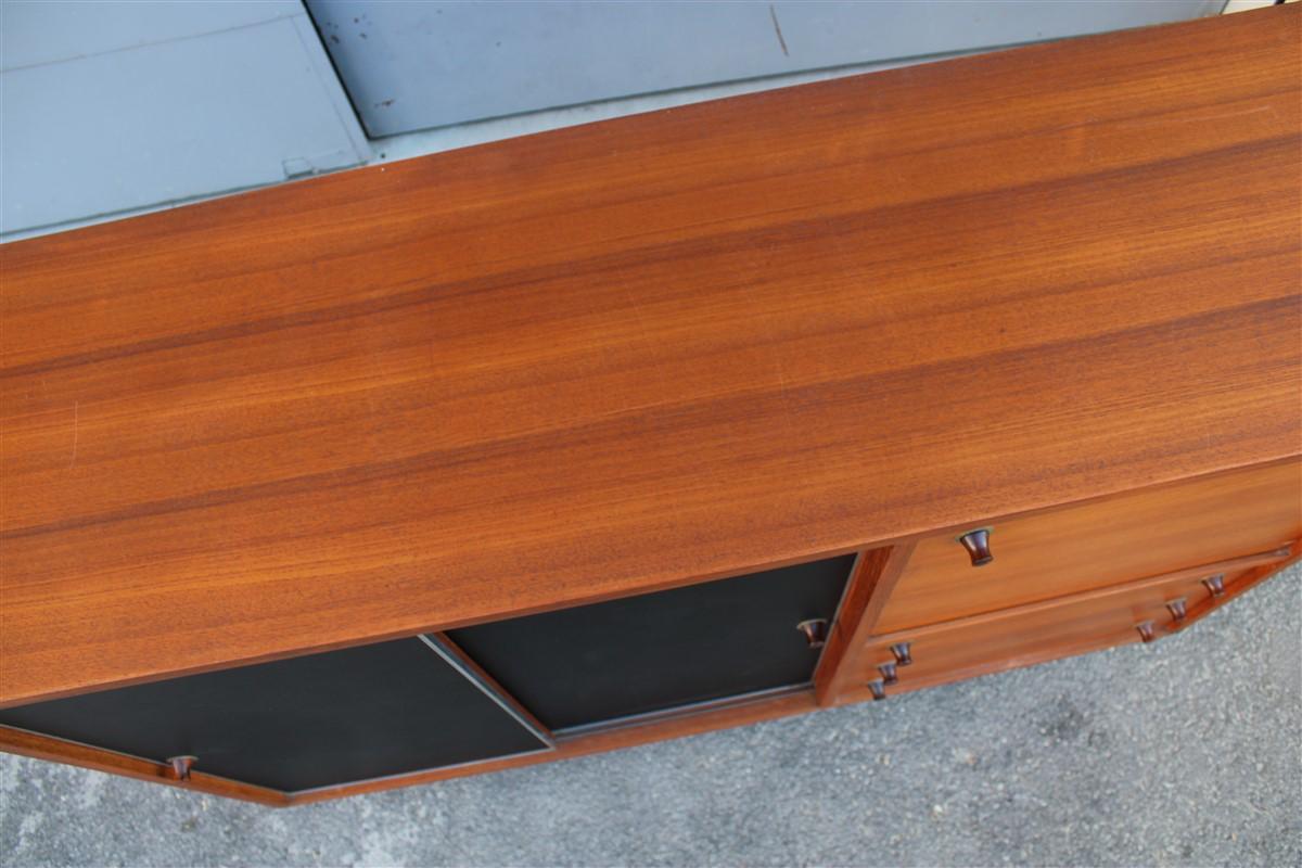 Square buffet Italian midcentury design solid teak black laminate brown, with internal and external drawers inside, excellent execution quality. Unfortunately there is a burn spot on the upper floor as shown in the photo.