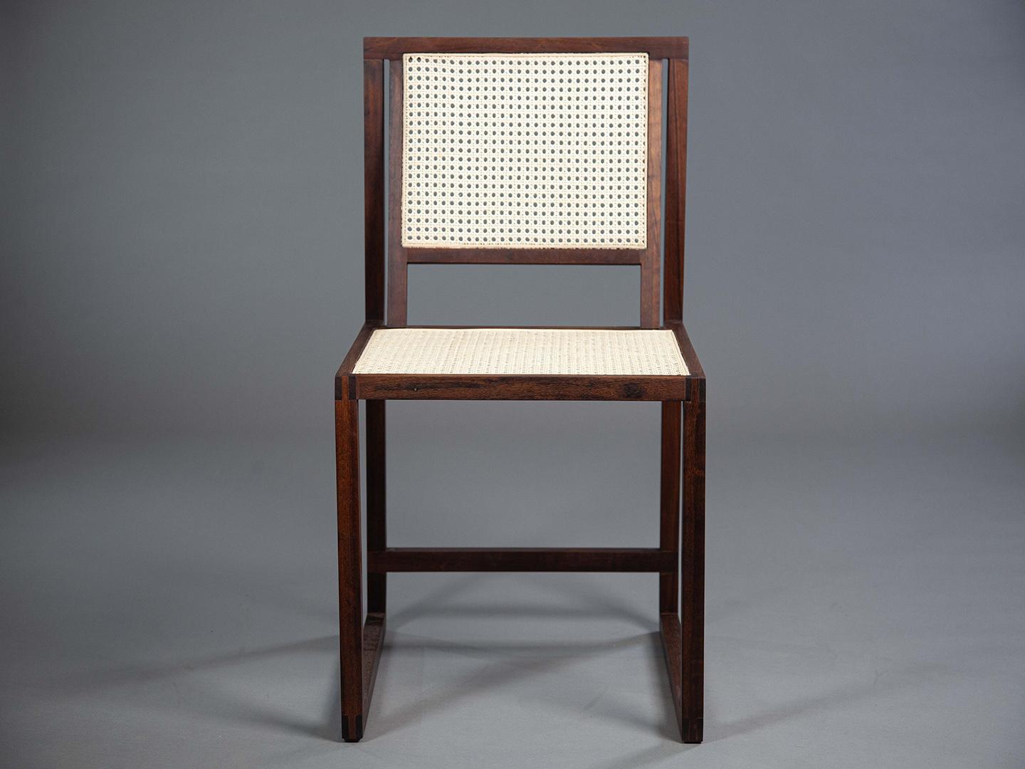 The Square Chair was designed to be used at dining tables and desks. Made from sucupira, freijó, jequitibá, or imbuia, it offers high comfort while remaining lightweight and durable. The backrest is crafted from natural Indian wicker, and the seat