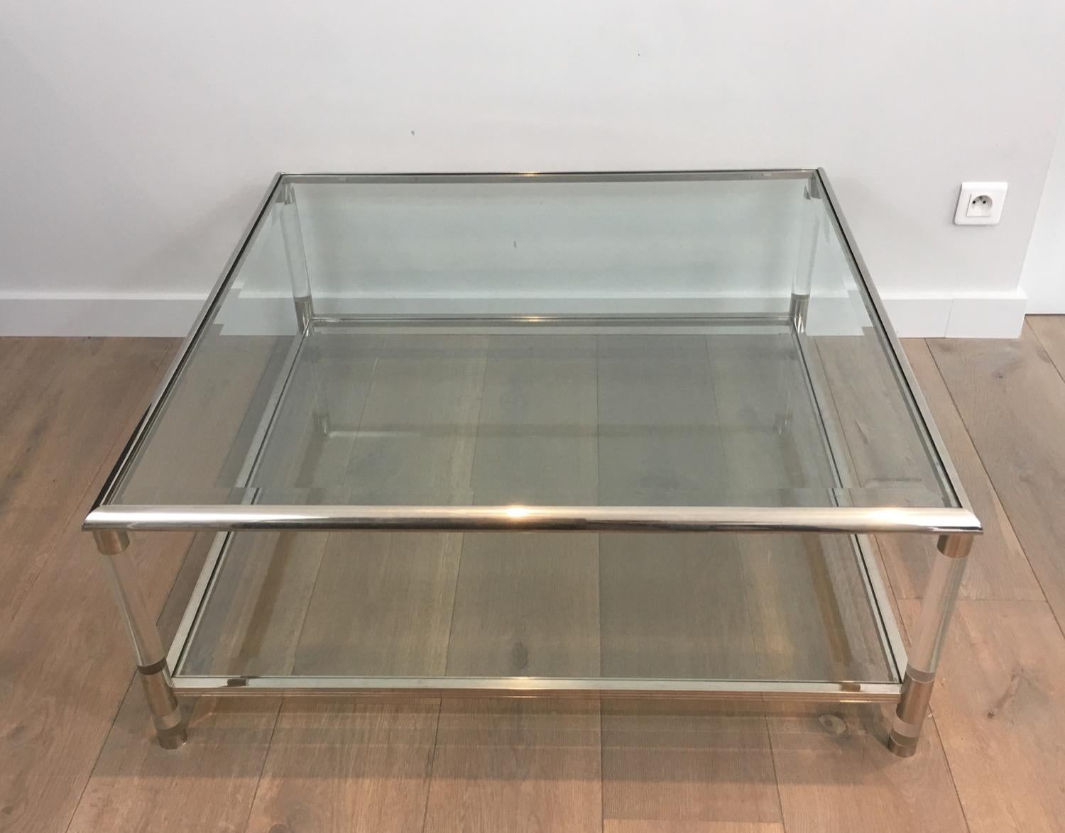 Square chrome coffee table with Lucite rounded legs and 2 glass shelves. The top glass is beveled and the corners are slightly rounded on the top. French, circa 1970.