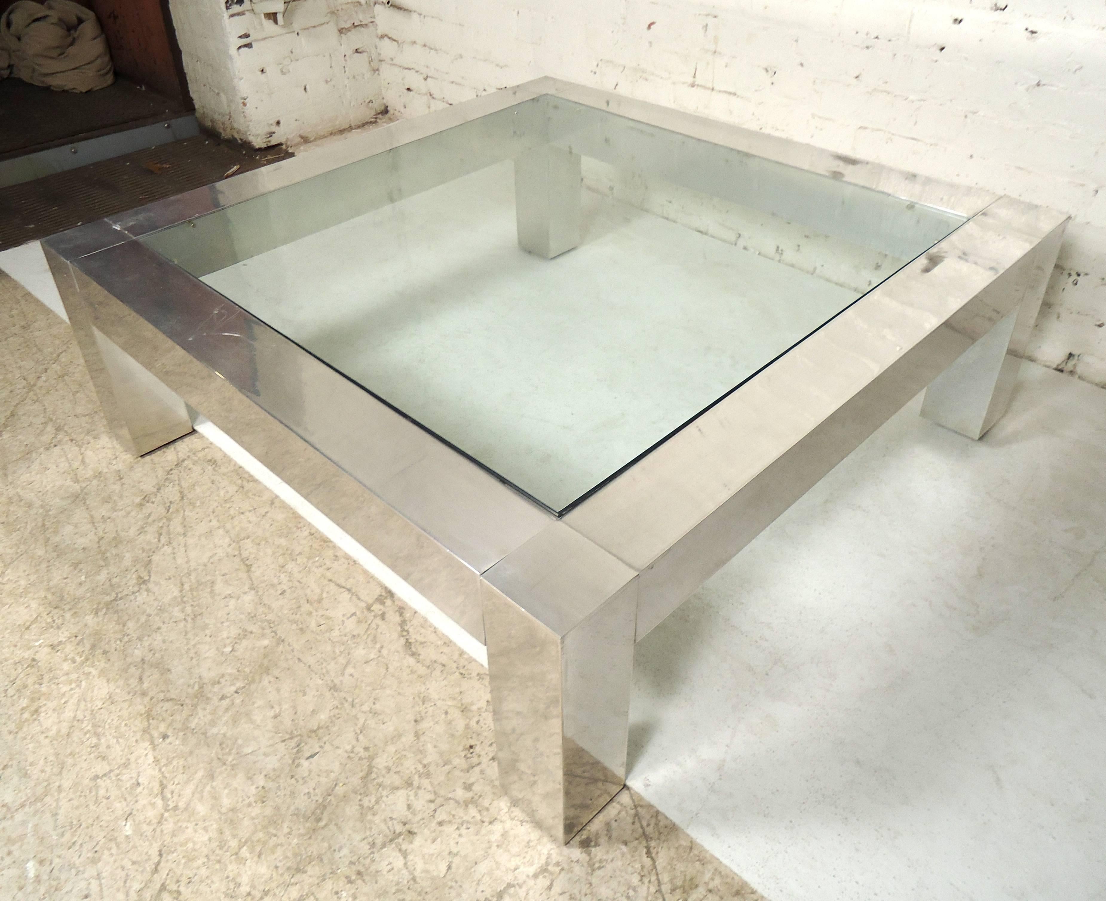 Large square chrome frame coffee table with glass. Great for a large living room or office area.

(Please confirm item location - NY or NJ - with dealer).