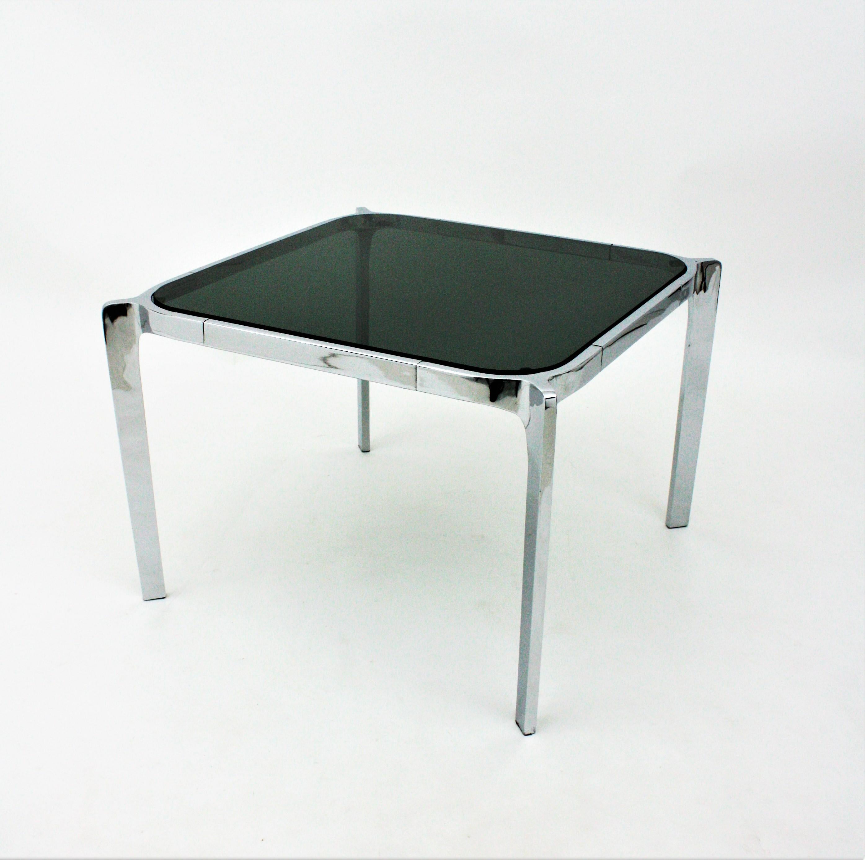 Mid-Century Modern squared chromed steel table with smoked glass top, Spain, 1970s.
Interesting as coffee table or end / side table near a sofa.
The chromed steel has been cleaned and polished.
Measures: 57 cm W x 57 cm D x 40 H ( 22,44 in W X 22,44
