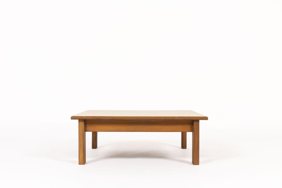 Square coffee table by the famous French designer and manufacturer Andre Sornay produced in the 1960s. 
Composed of a structure in solid Beechwood and a beige laminate top in perfect condition.
 