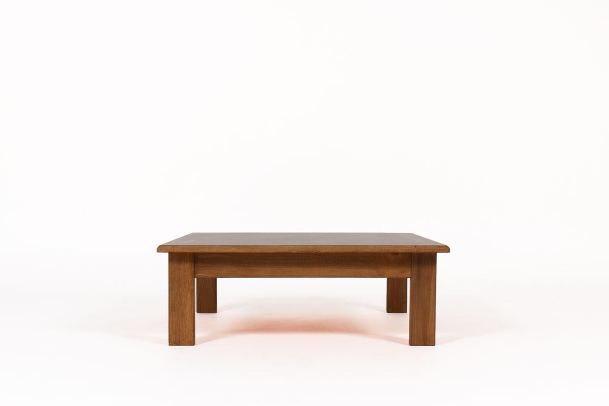 Square coffee table by the famous French designer and cabinetmaker Andre Sornay produced in the 60s. 
Composed of a solid beech structure and a black laminate top.