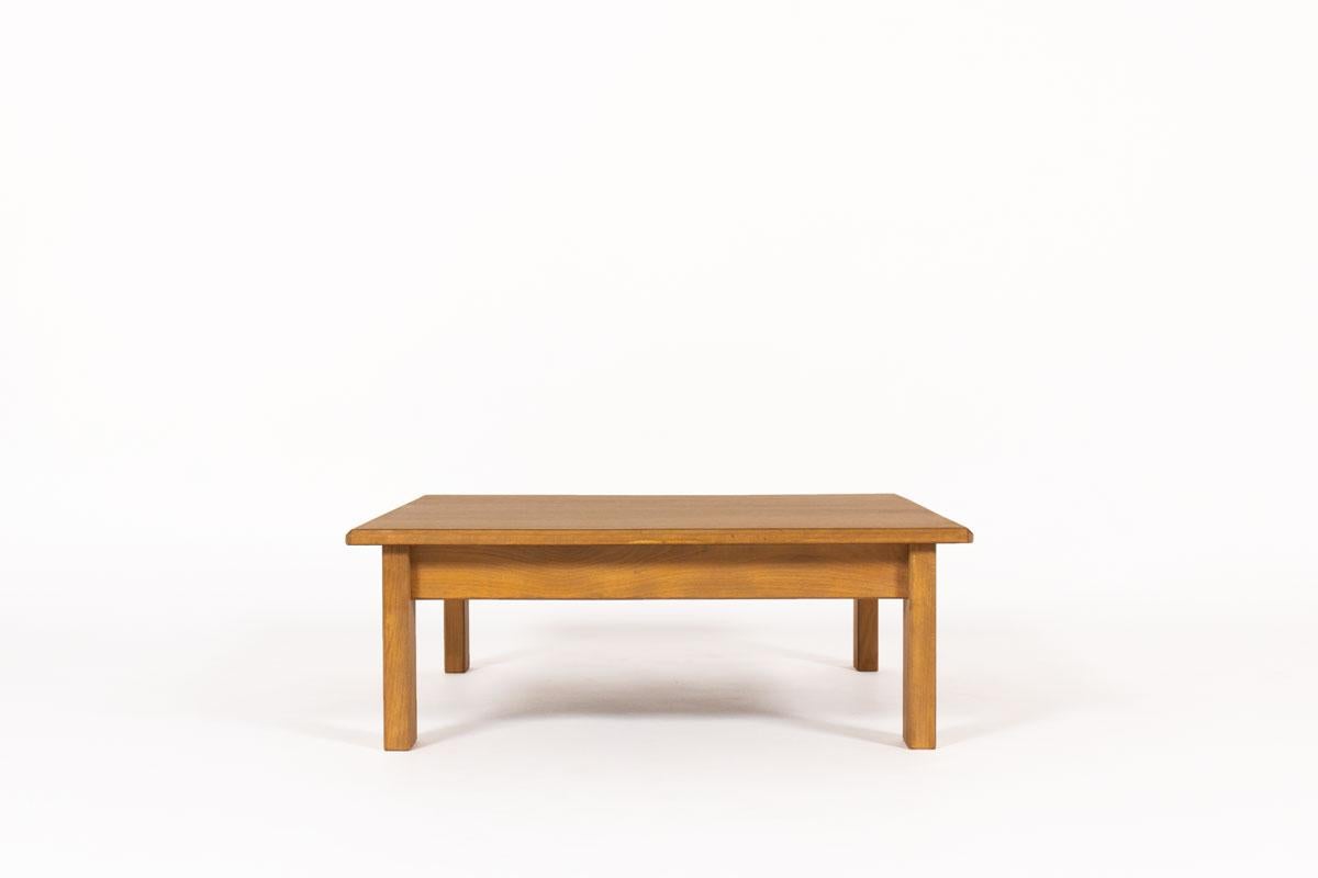 Square coffee table by the famous French Designer and manufacturer Andre Sornay produced in the 60s. 
Composed of a solid beech structure and a oak veneer top. All in very good condition.