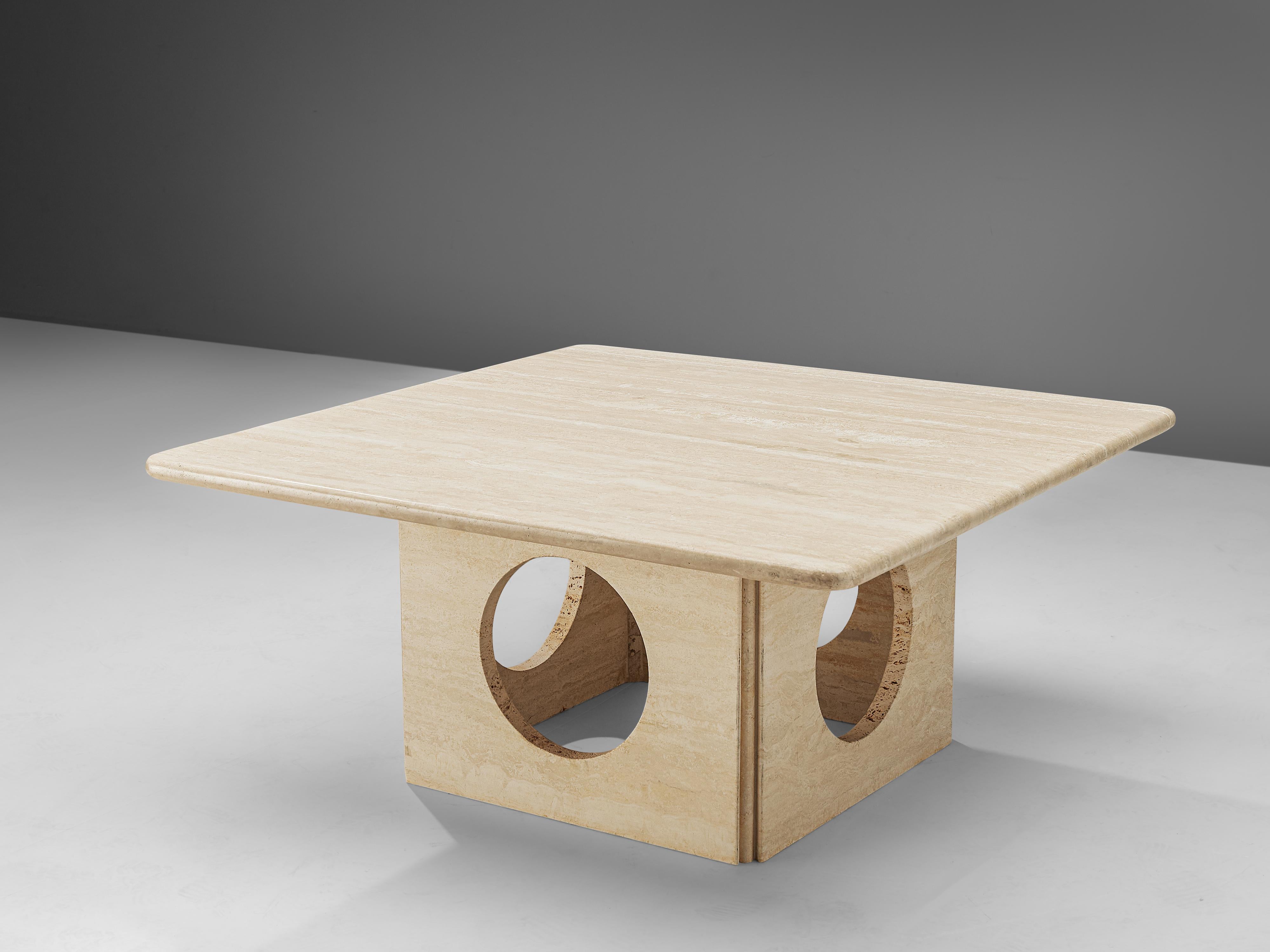Coffee table, travertine, Italy, 1970s.

This interesting coffee table features a thick squared travertine tabletop with a square base that has four round shaped holes, creating a beautiful play with geometric lines. These aesthetics are