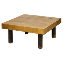 Square coffee table with brass inlays and darkened wood legs