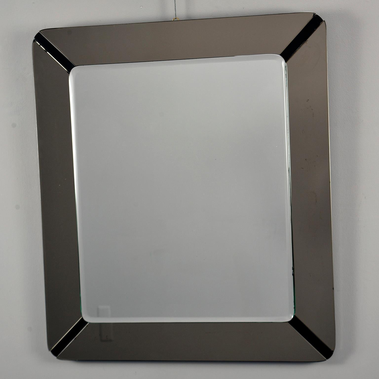 Square mirror with smoke-colored glass frame attributed to Italian maker crystal arte, circa 1970s. Very good vintage condition with some minor loss of silvering to mirror at edges. See detail photos.

Actual mirror size: 23.5” H x 19.75” W.