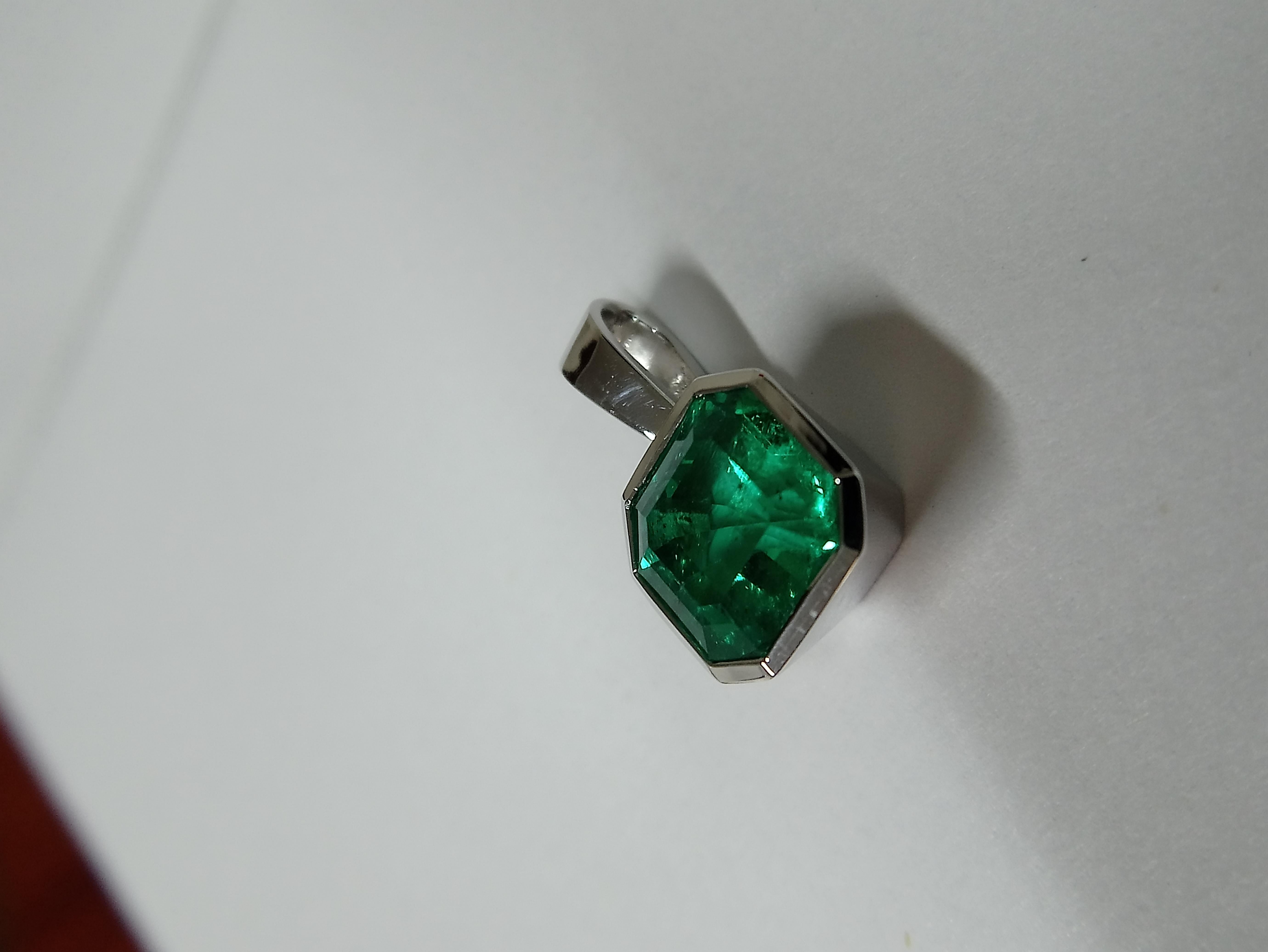 This square cut, 4 carat Colombian emerald pendant is channel set in 18K white gold, giving the stone superb all round protection.  It can be placed on any white gold chain (which can be provided free of charge) or it could be reset as a ring,