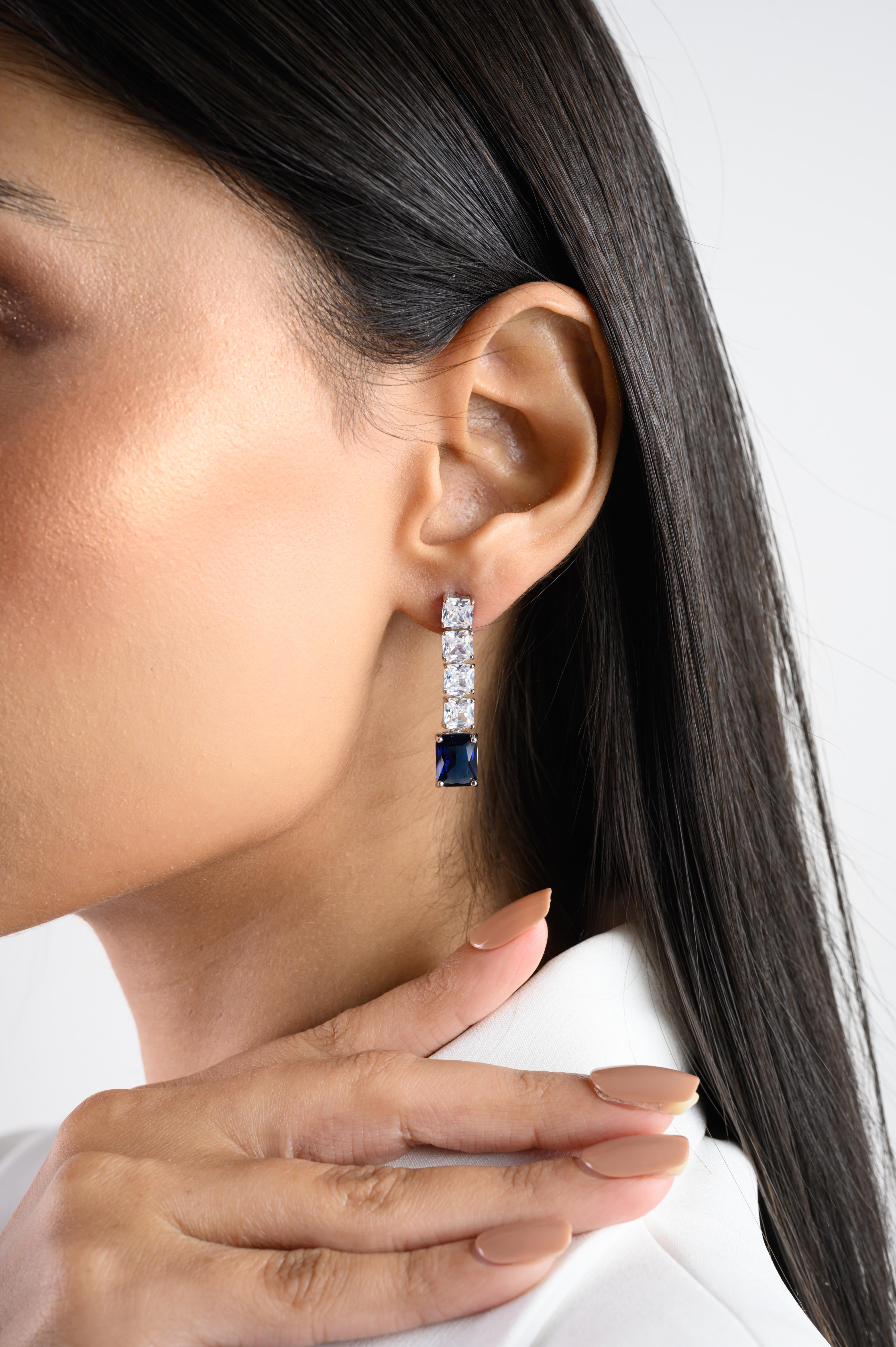 Square Cut Blue Zircon Drop Earrings in sterling silver. You shall need these statement drop earrings to make a statement with your look. Each piece features dazzling cubic zirconia stones, renowned for their brilliance and clarity, set in