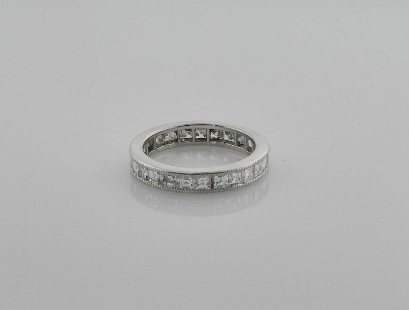 Square Cut Diamond Eternity Ring in White Gold
Twenty Seven Square Cut Diamonds weighing 2.45 carats approximately GH VVS-VS1 [fine quality]
Size 6 1/4
Beautifully Made.  