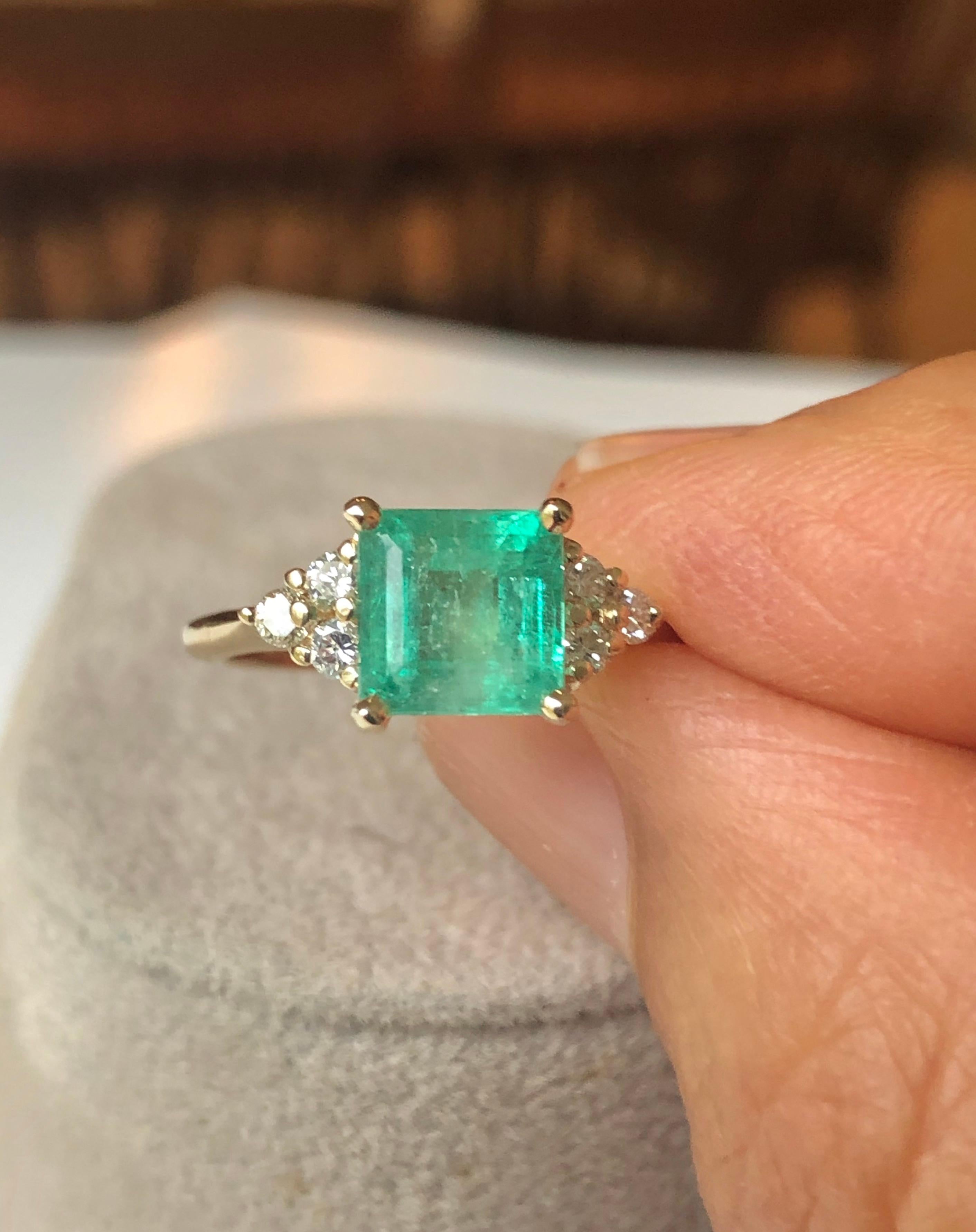 This is a Gorgeous Colombian Emerald and Diamond Engagement Ring set with a square cut emerald weighing 1.70 carats (7.1x7.2mm), within six round brilliant cut diamonds H/SI1 weighing approximately  .30 carats. Set in yellow gold 14K. 
Feature one