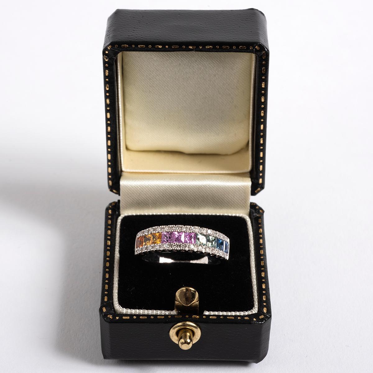 A unique piece within our carefully curated Vintage & Prestige fine jewellery collection, we are delighted to present the following:

Our beautiful multi coloured sapphire and diamond ring has an 9k white gold band and is set with square cut