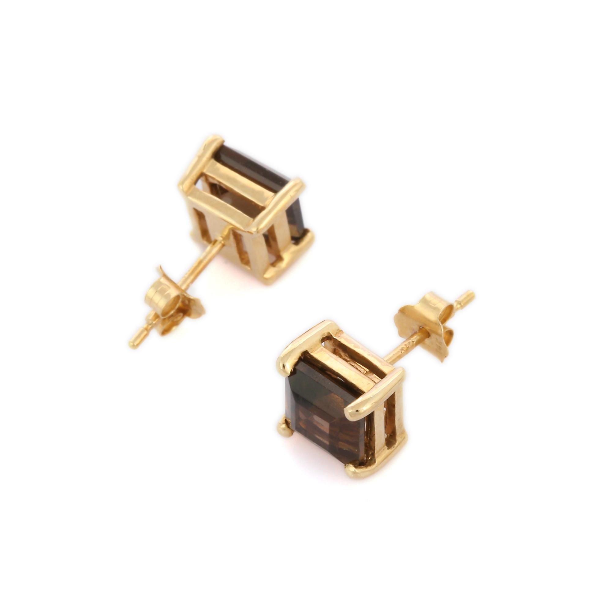 Studs create a subtle beauty while showcasing the colors of the natural precious gemstones.

Square cut smoky quartz studs in 14K gold. Embrace your look with these stunning pair of earrings suitable for any occasion to complete your