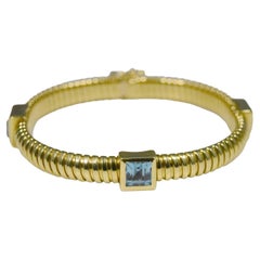 Bracelet souple en or jaune 18 carats avec topaze taille carrée