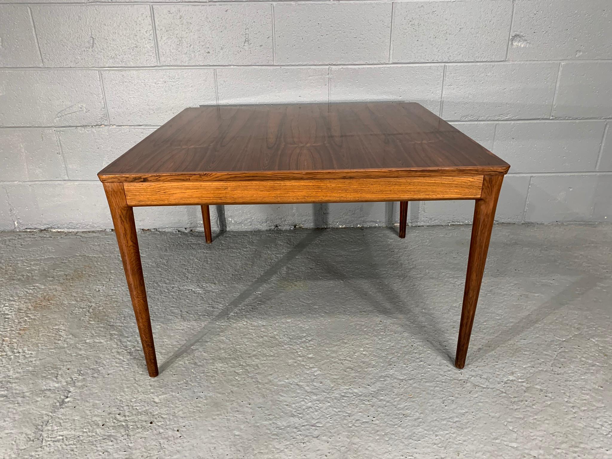 Square Danish modern midcentury rosewood coffee table by Uldum Møbelfabrik with UM made in Denmark foil label underneath piece.