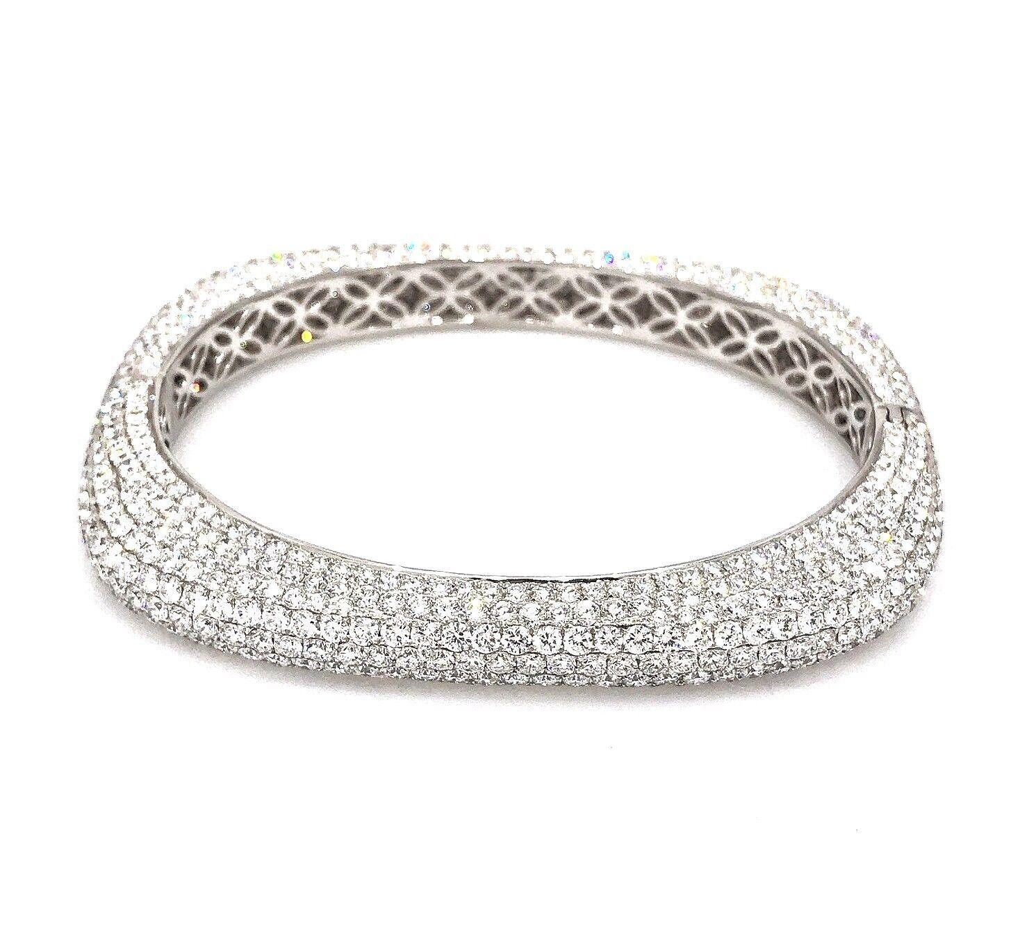 Rounded Square Diamond Pave Bangle Bracelet 18k White Gold

Diamond Pave Bangle Bracelet Rounded Square Shape features 22.59 carats of Round Brilliant Full cut Diamonds Pave set over entire bangle with oval opening. The bangle fits a size 7