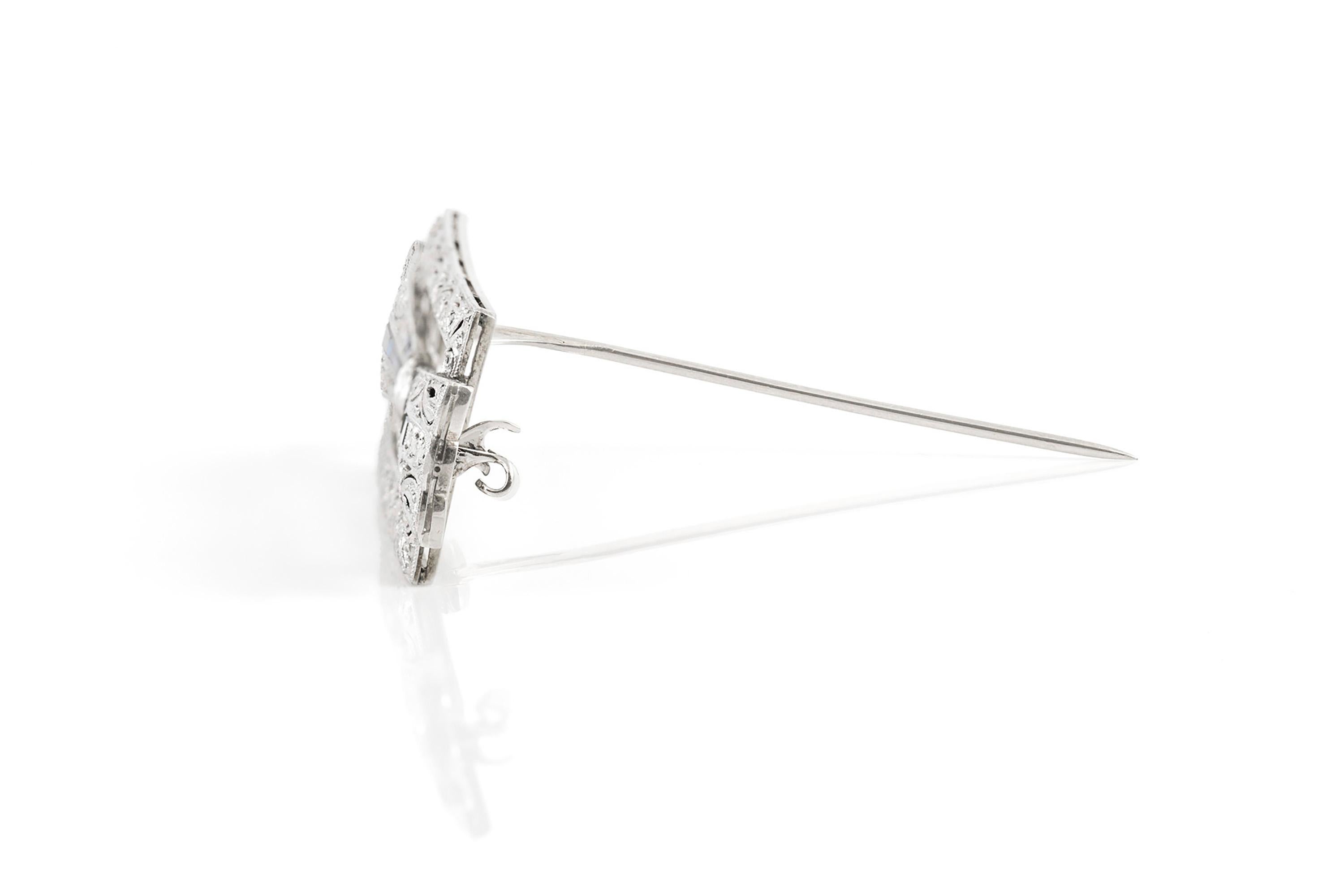 The brooch is finely crafted in platinum with diamonds weighing approximately 1.50 carat and syntetic sapphire.