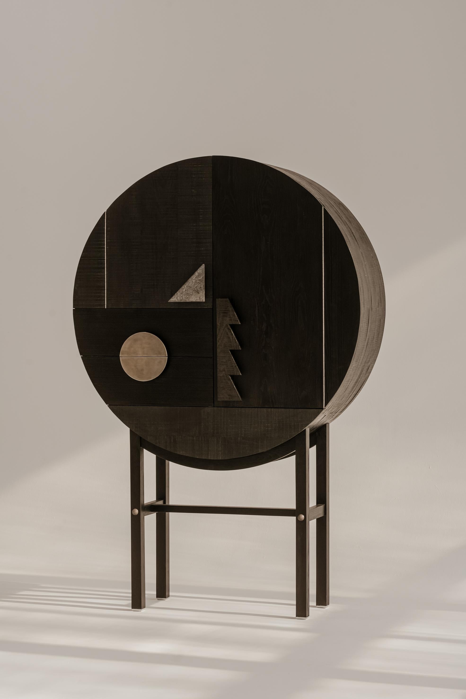 Square Drop Black Cabinet by Nów
Designed by Square Drop 
Dimensions: D 42 x W 120 x H 182 cm
Materials: stained, solid ash wood, cast iron hardware, steel, natural stone.

Agnieszka Sniadewicz-Swica, owner of Square Drop restoration lab, has