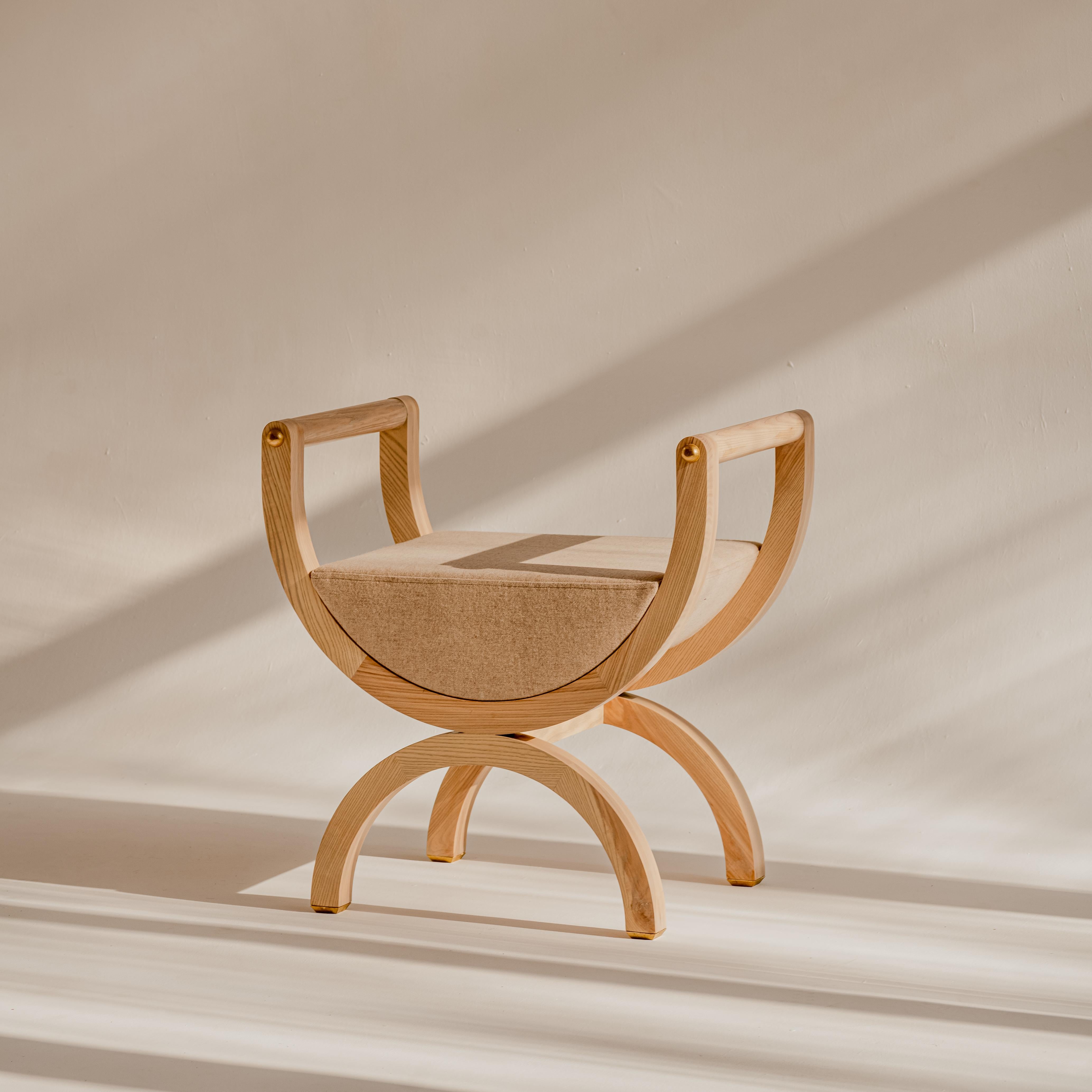 Square drop light Curule chair by Nów
Designed by Square Drop 
Dimensions: D 46 x W 67 x H 69.5 cm
Materials: stained, solid ash wood, brass hardware, natural wool seat

Agnieszka Sniadewicz-Swica, owner of Square Drop restoration lab, has been