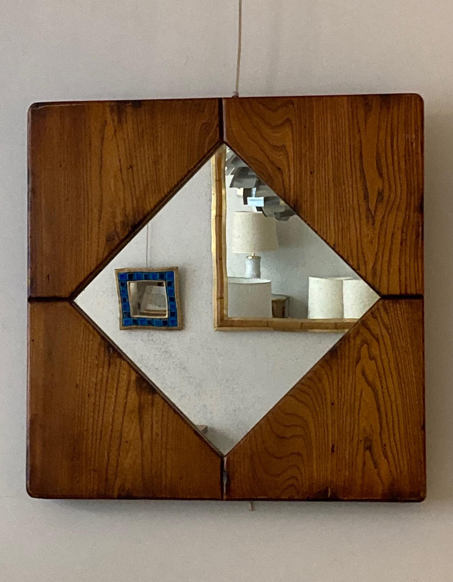 An elm-wood mirror with nice patina 
France, circa 1970.